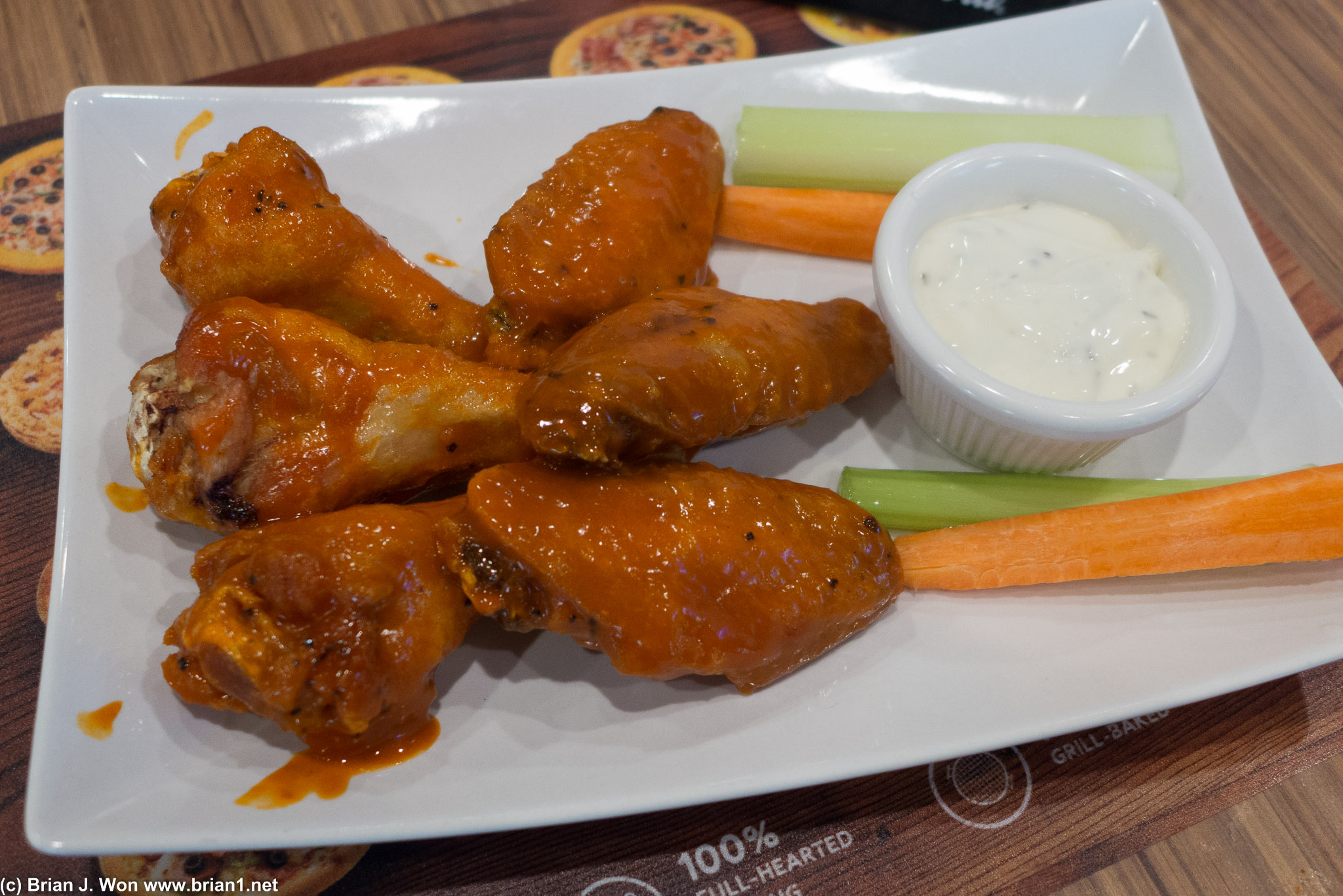 Snacking on some so-so buffalo wings.