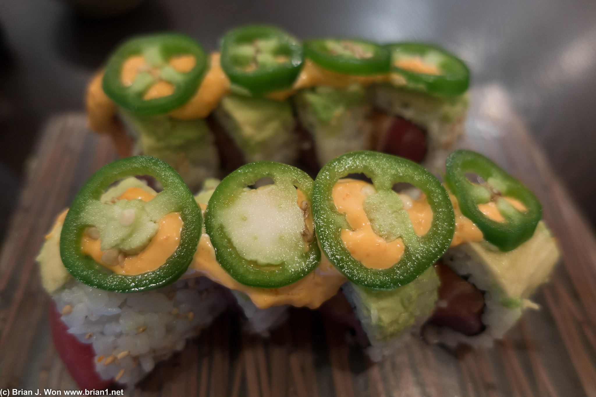 911 Roll-- tuna with avocado and jalapeno on top.