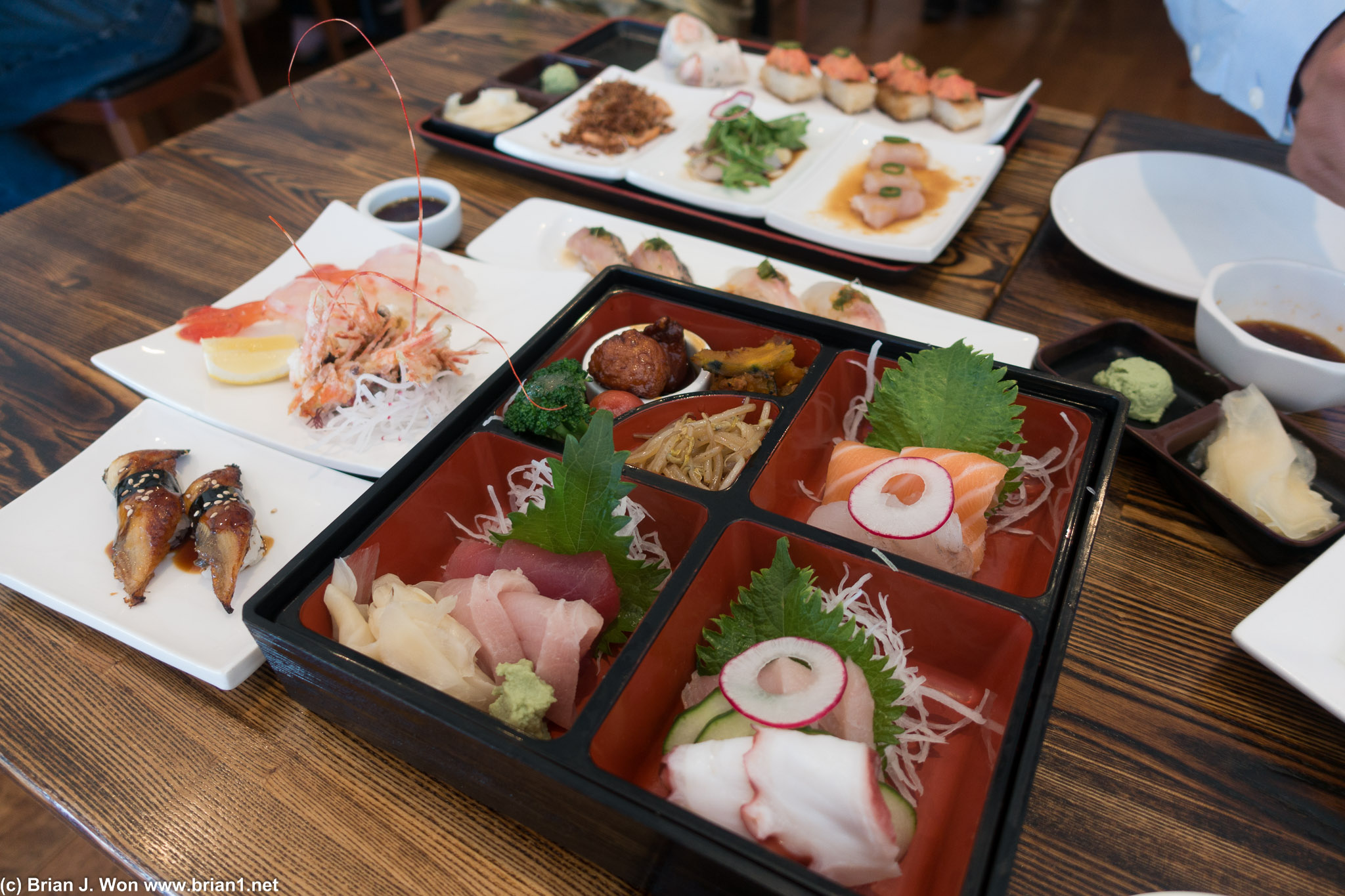 Sashimi in foreground, plus lots of sushi!