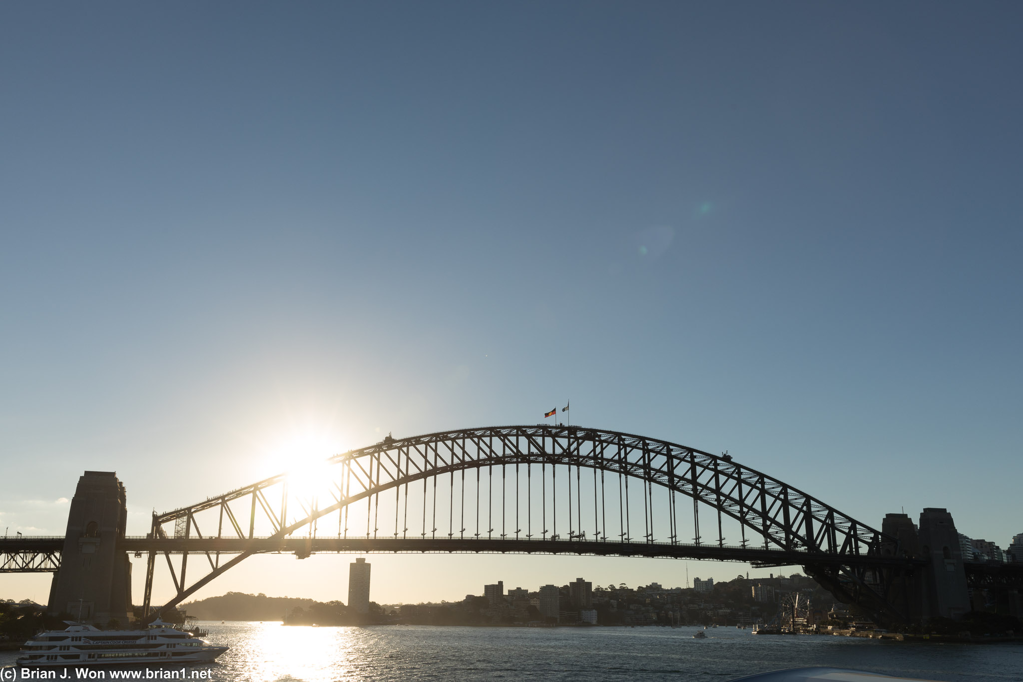 Sun aims low over Sydney Harbour Bridge.