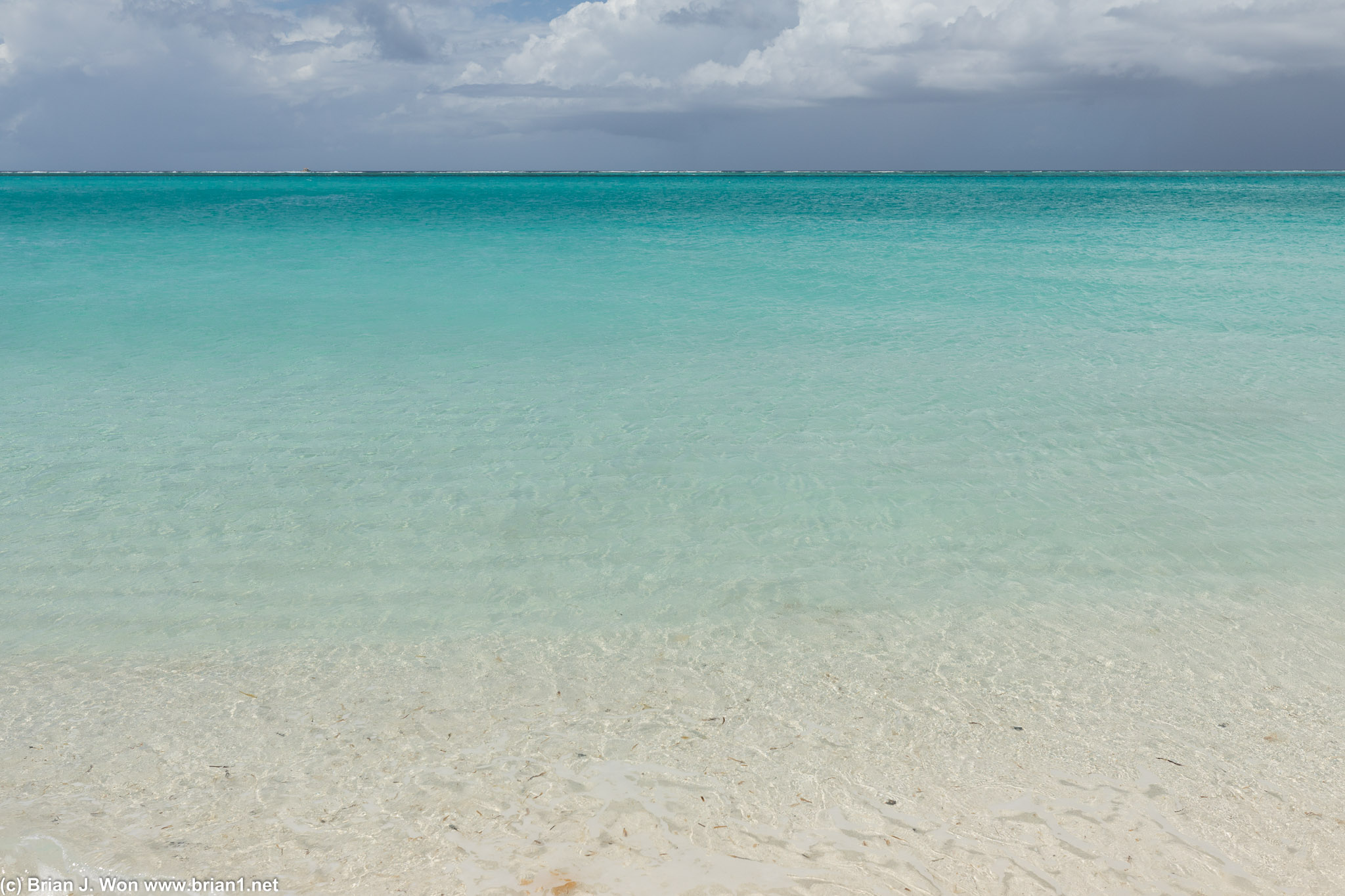 Clear turquoise water as far as the eye can see.