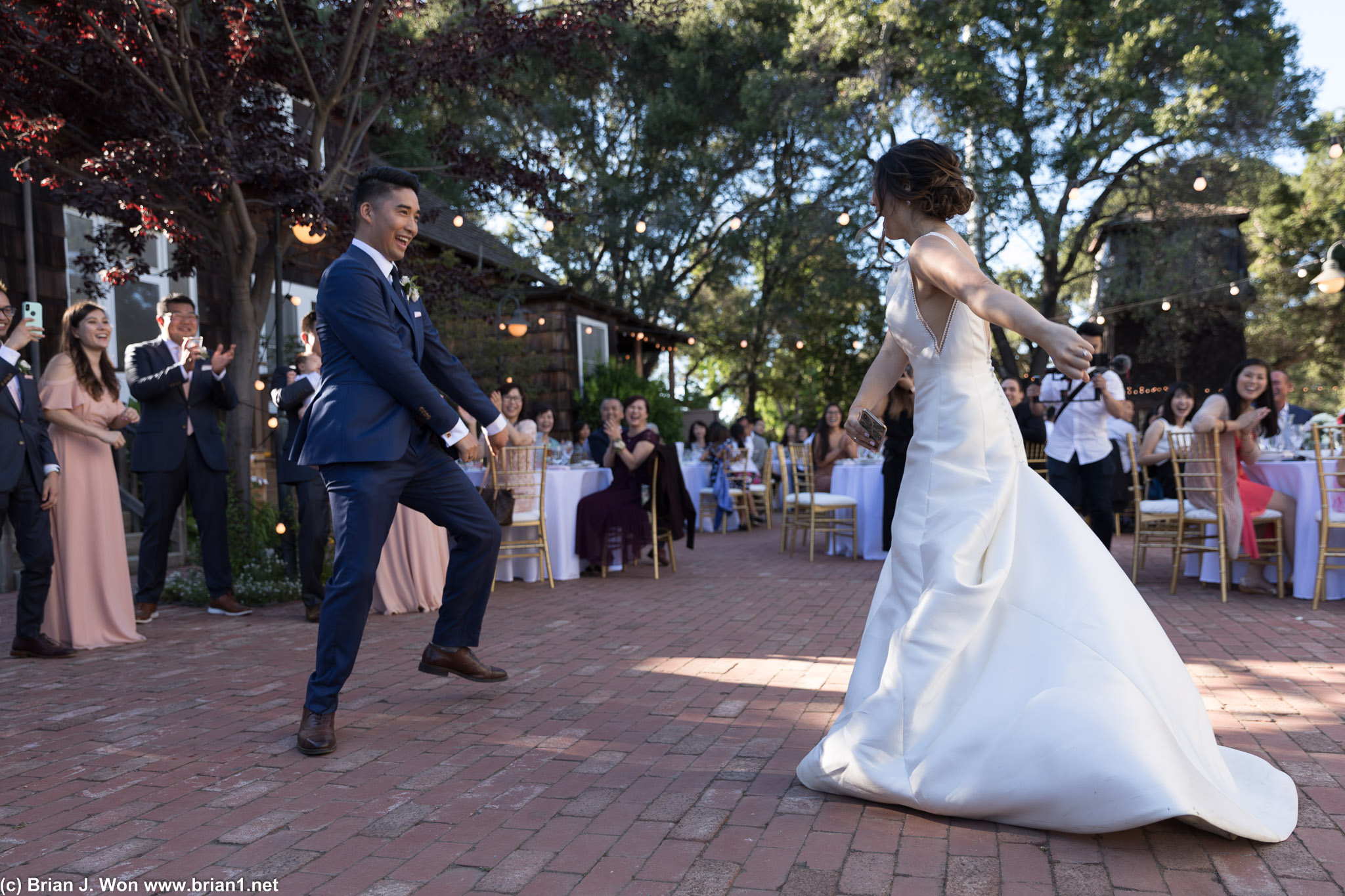 The bride and groom begin dancing immediately.