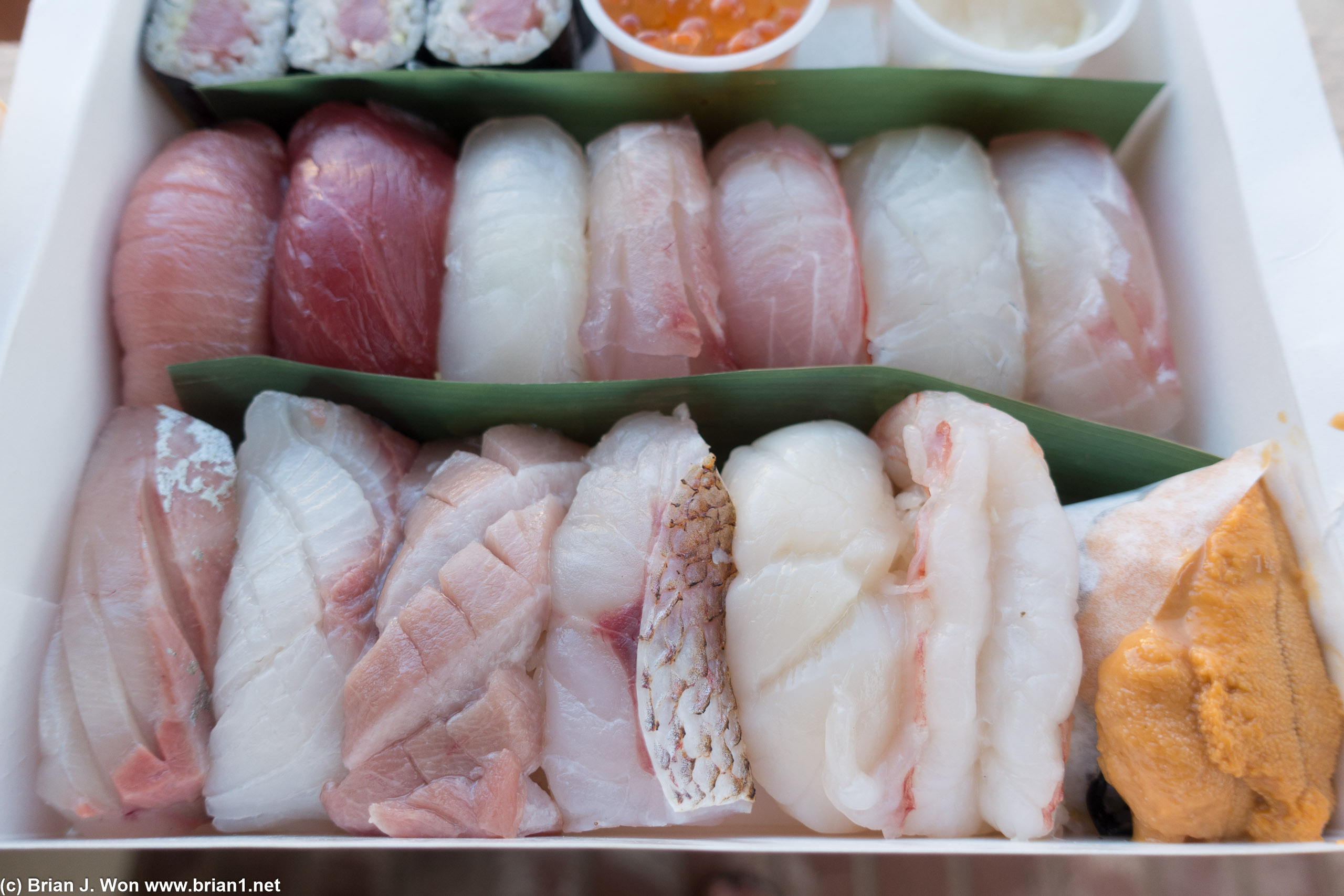 Foreground is kanpachi (amberjack), shimaaji (jack mackerel), nodoguro (black throat seaperch), ama ebi (sweet shrimp), uni (sea urchin).