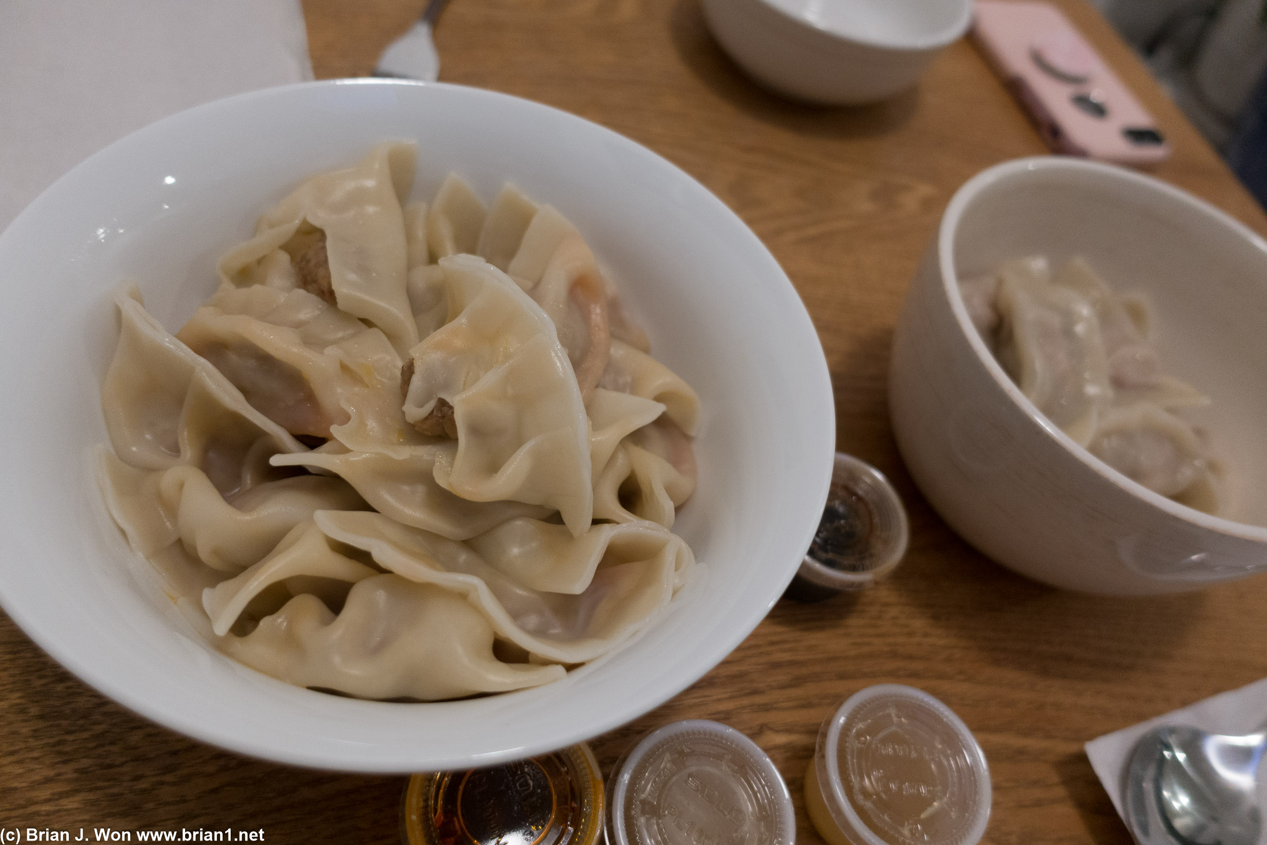At right, Kurobota pork dumplings, with cabbage, egg, garlic, soy, sesame, and chive filling.