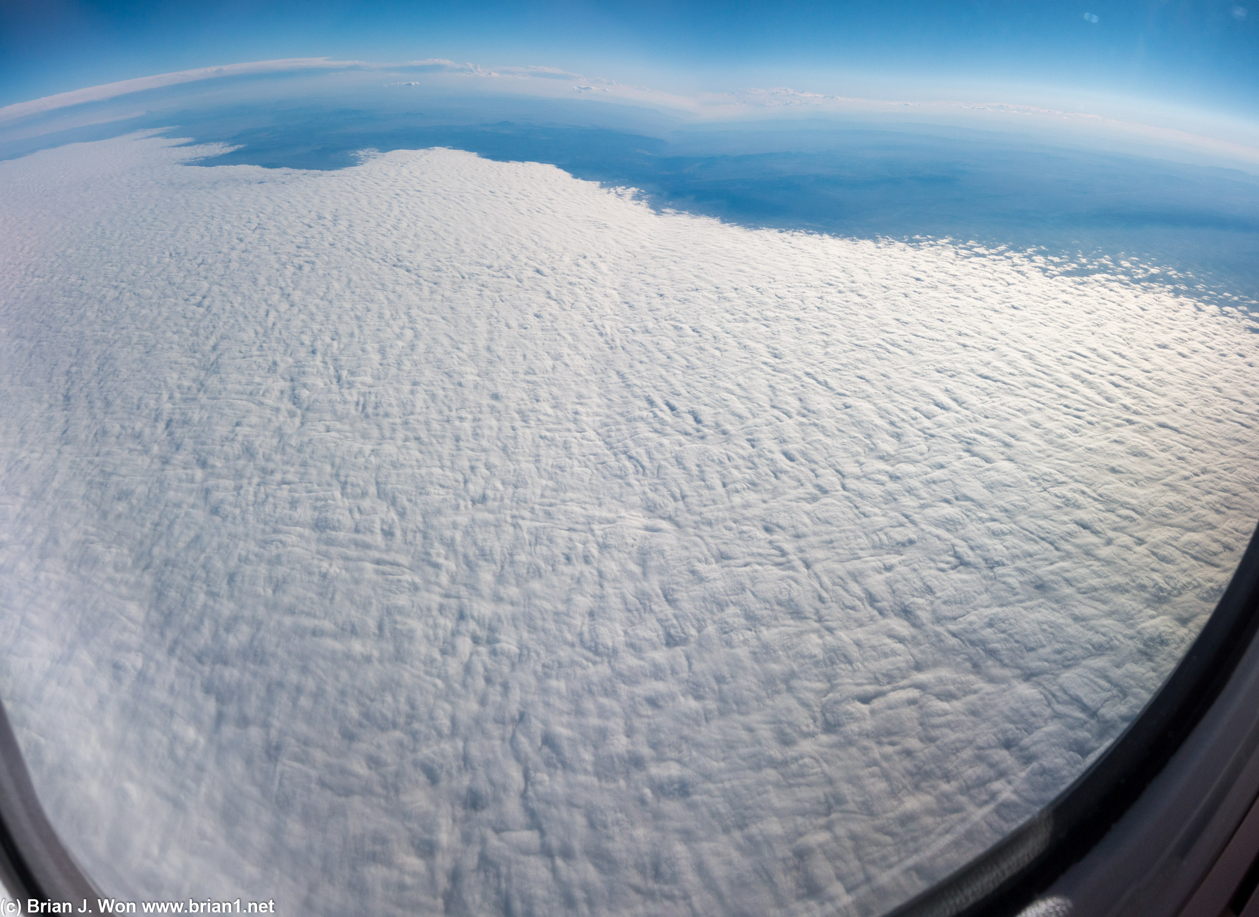 Almost 90 minutes after take-off, the clouds are finally starting to lift.