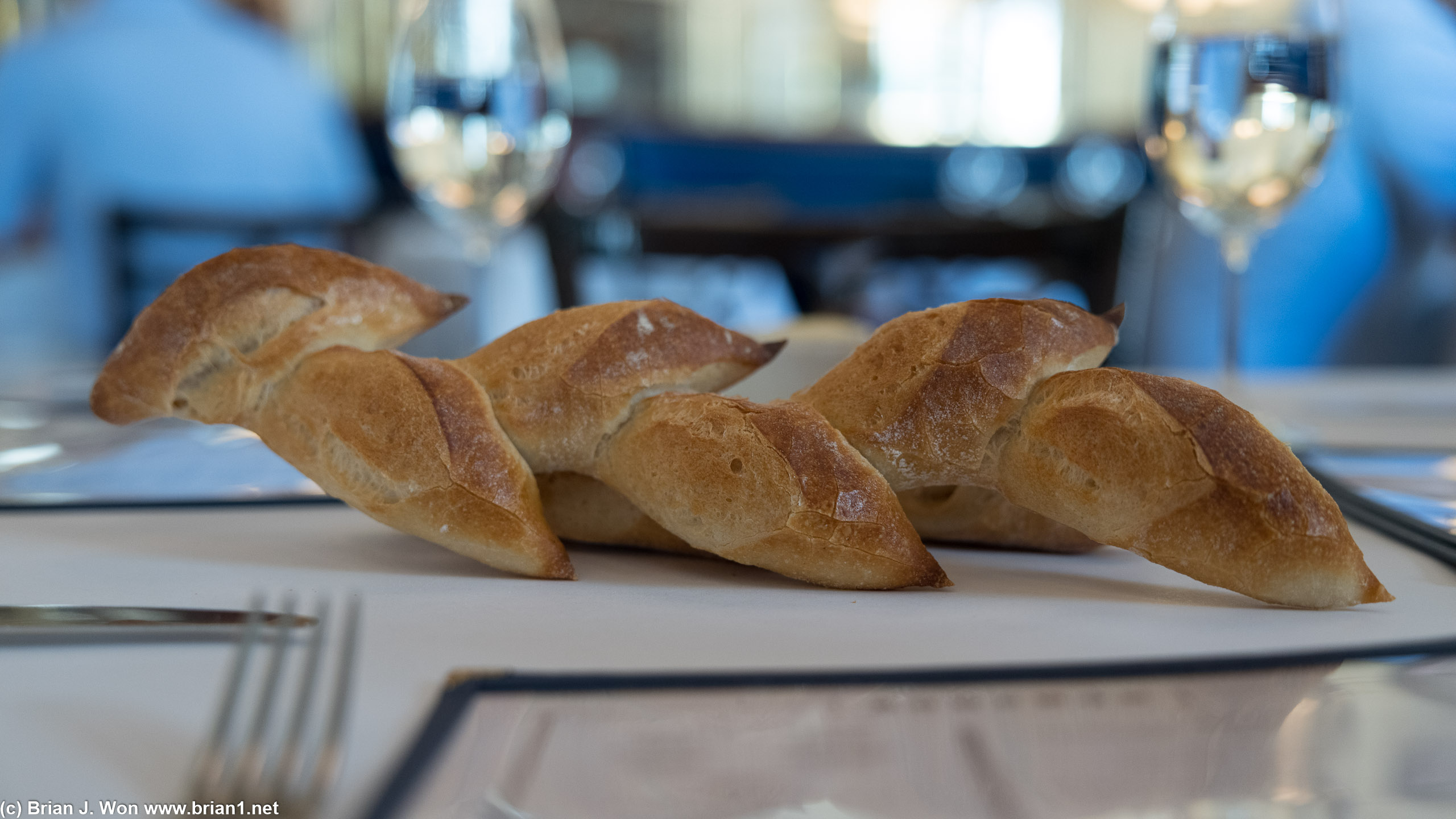 They literally plop bread onto the table at Bouchon.