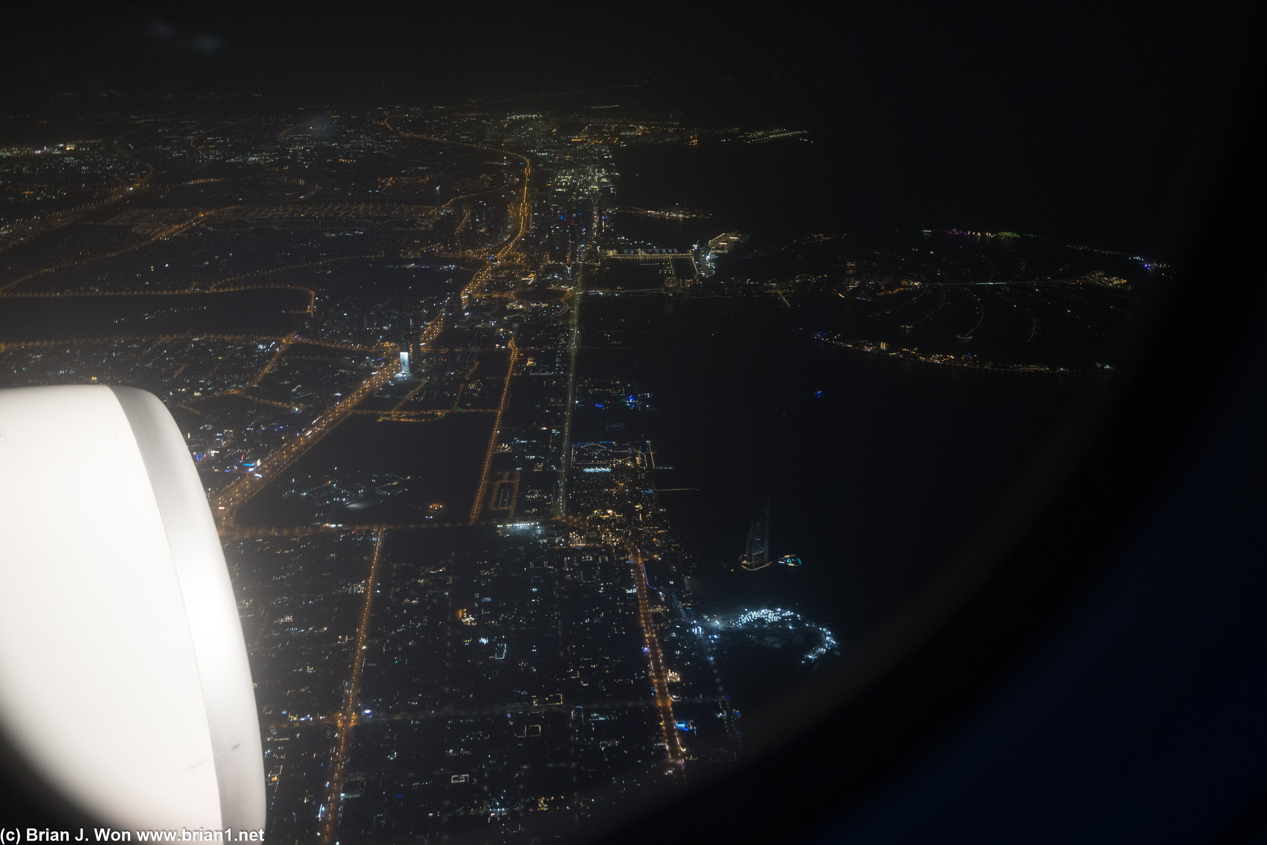 Climbing out with downtown Dubai and The Palm Jumeirah in the distance, the Burj Al Arab in the foreground.