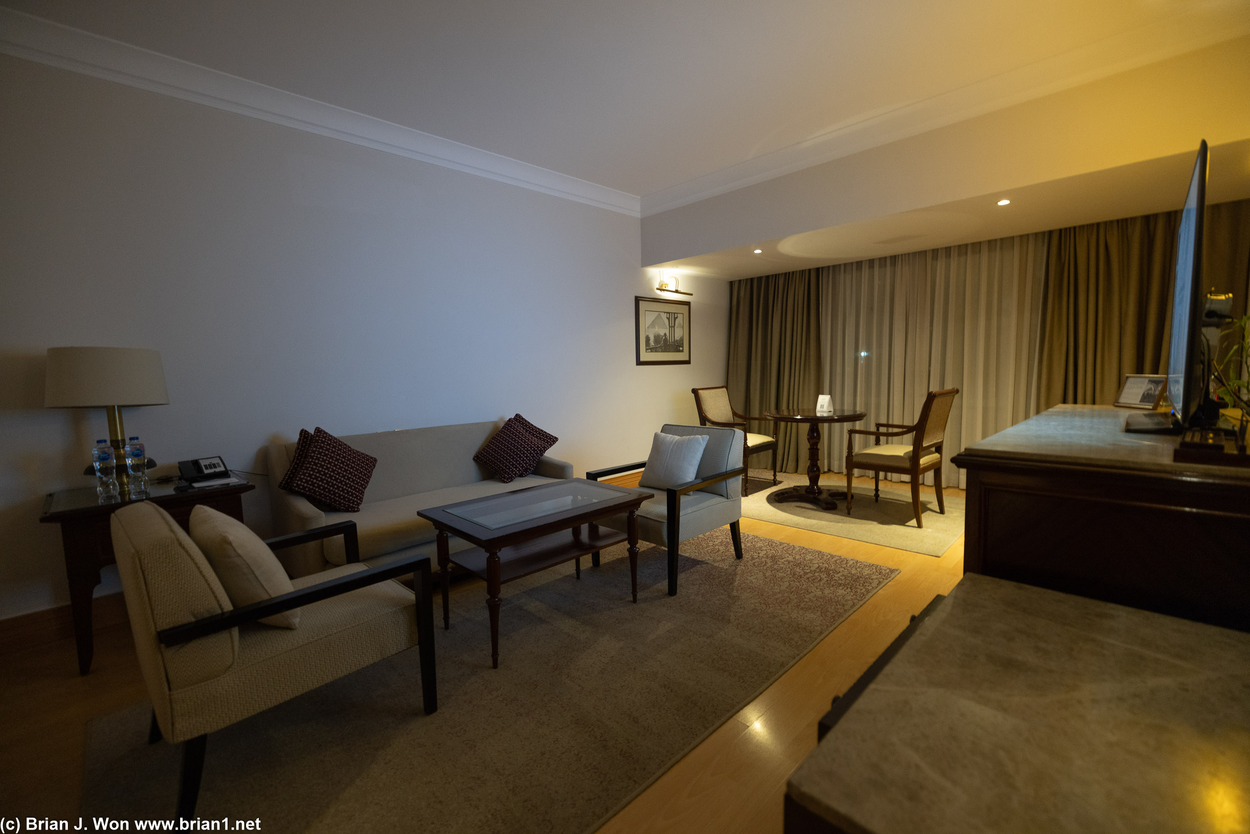 The "suite" is identical in size and layout to the bedroom, but with a couch and chairs instead of a bed.