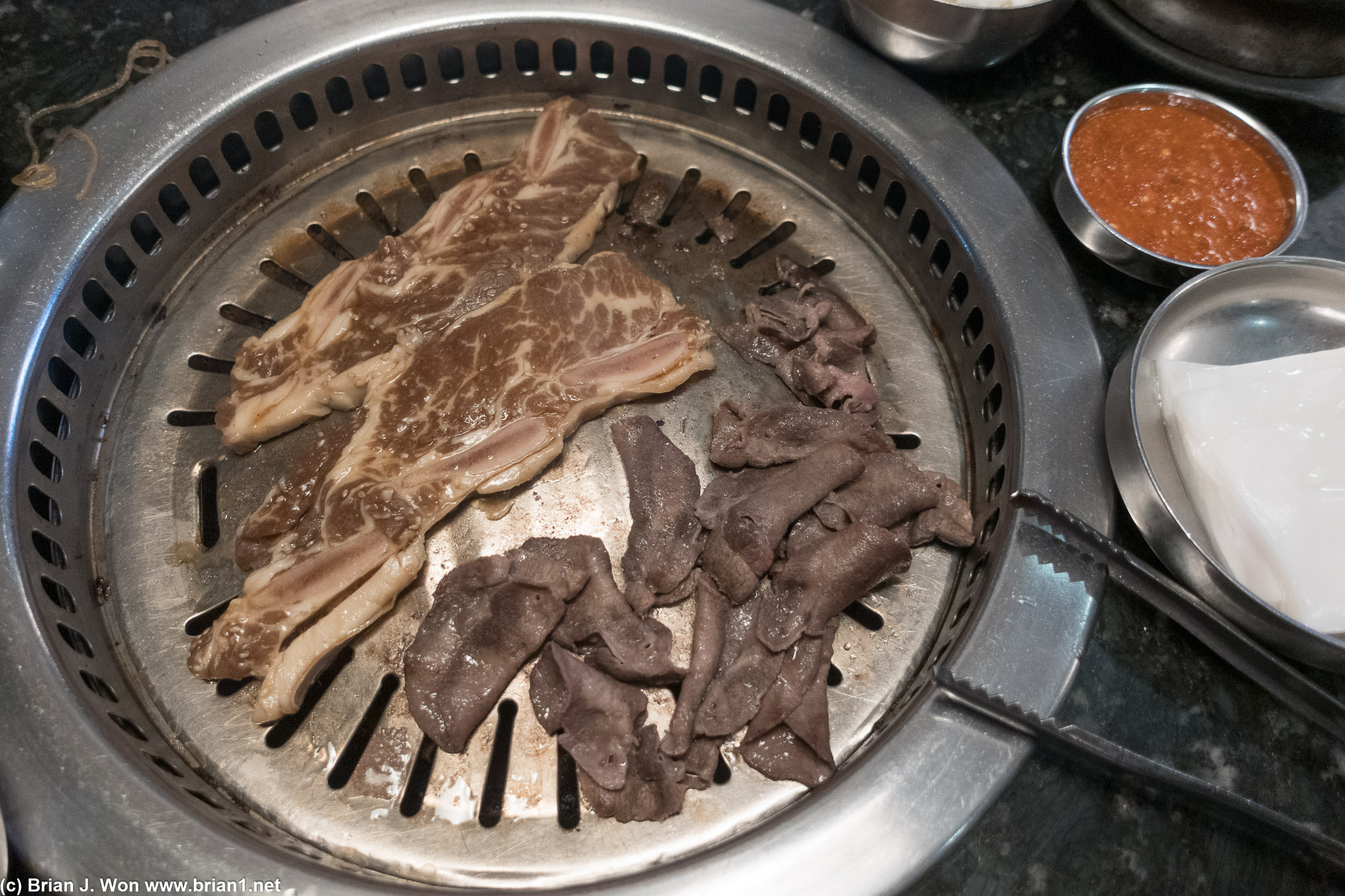 Galbi and tongue both on the grill.