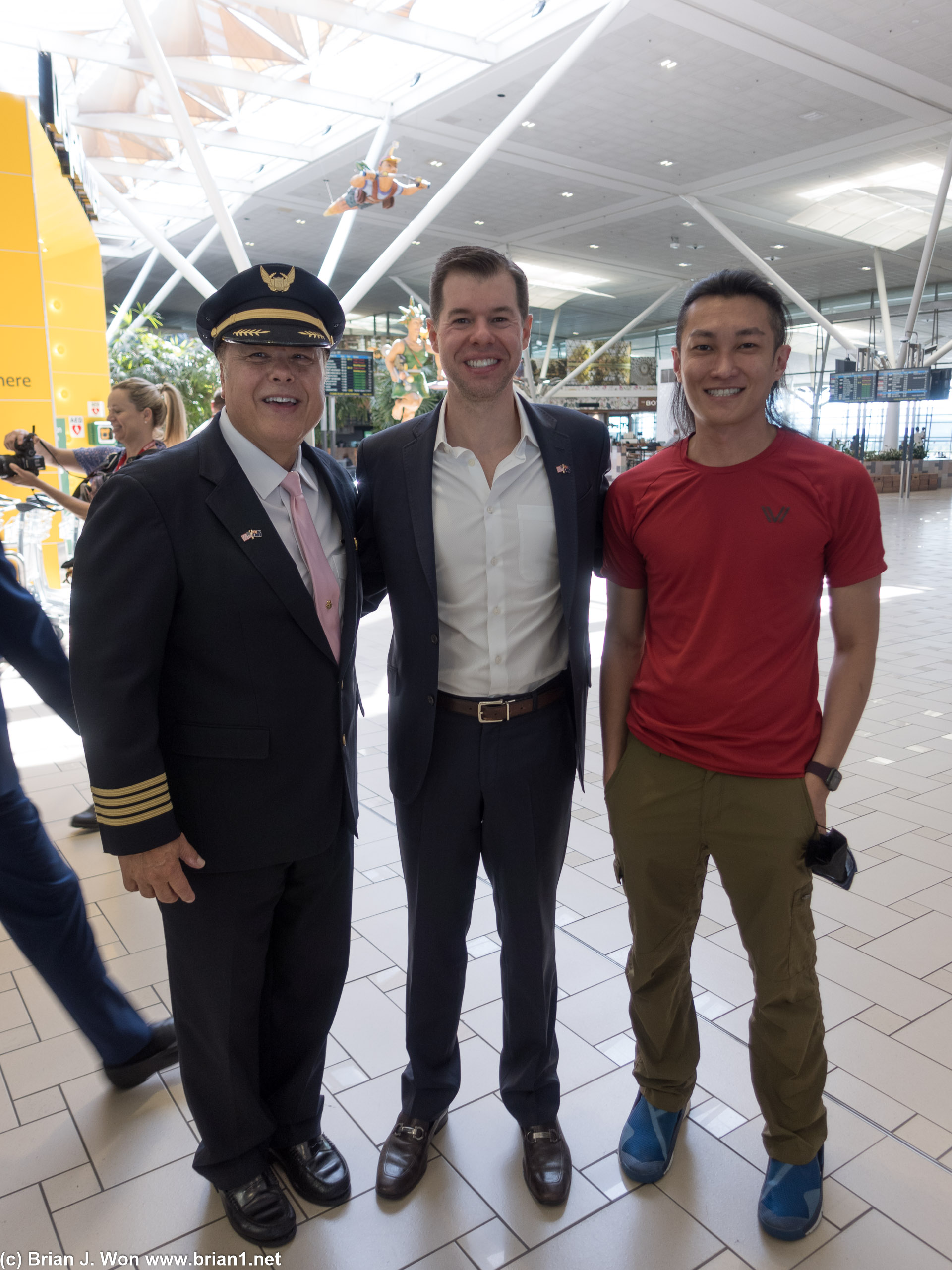 Carl Brothers' turn for a picture with United SVP Patrick Quayle and Captain Horanyi.
