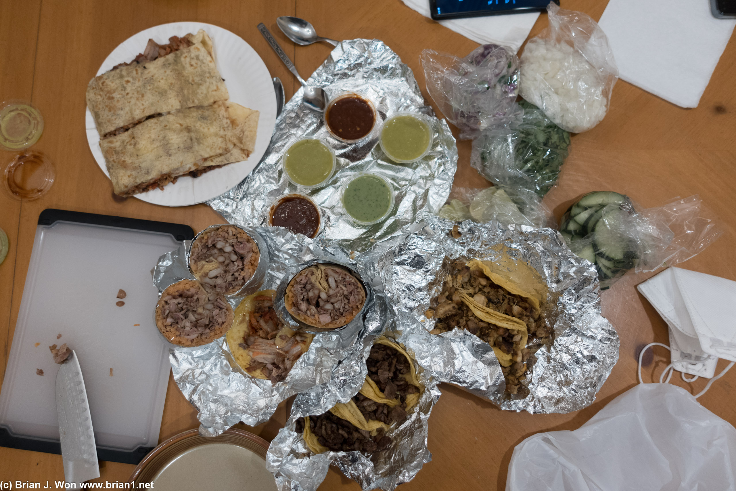 Al pastor quesadilla, buche burrito, carne asada, chicken, and al pastor tacos.