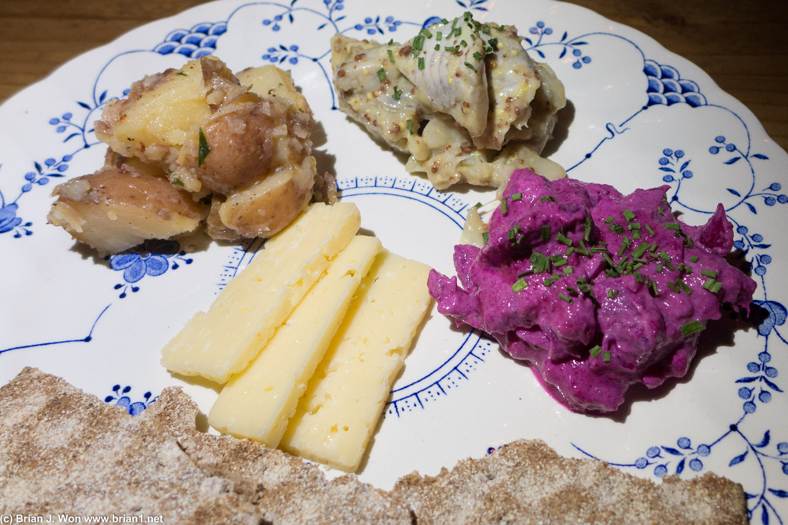 Herring plate. White herring was good, potatoes were also good, the pink herring was a ittle weird.
