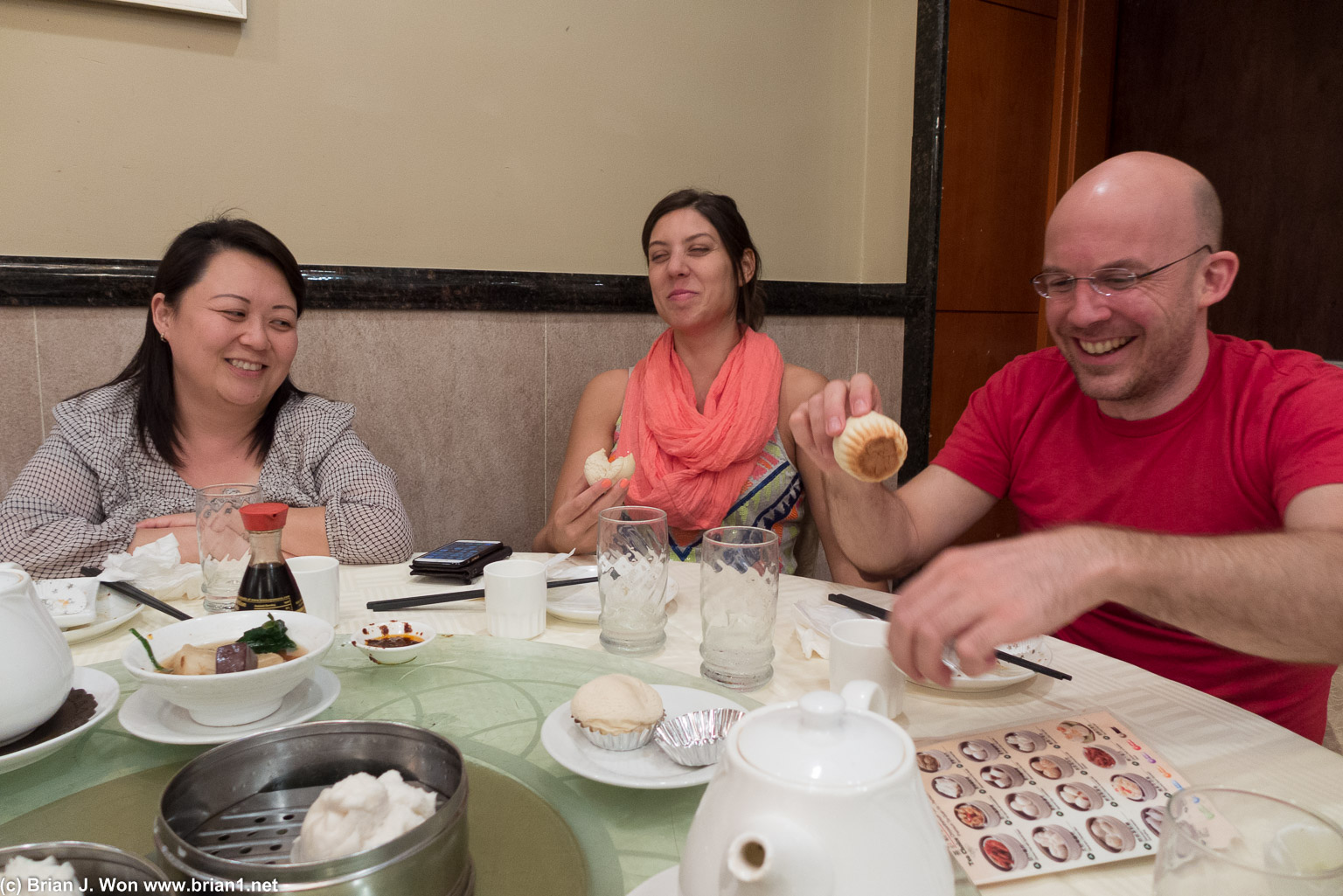 Sue, Carolina, and Dan laughing about Dan not recognizing his favorite dessert.