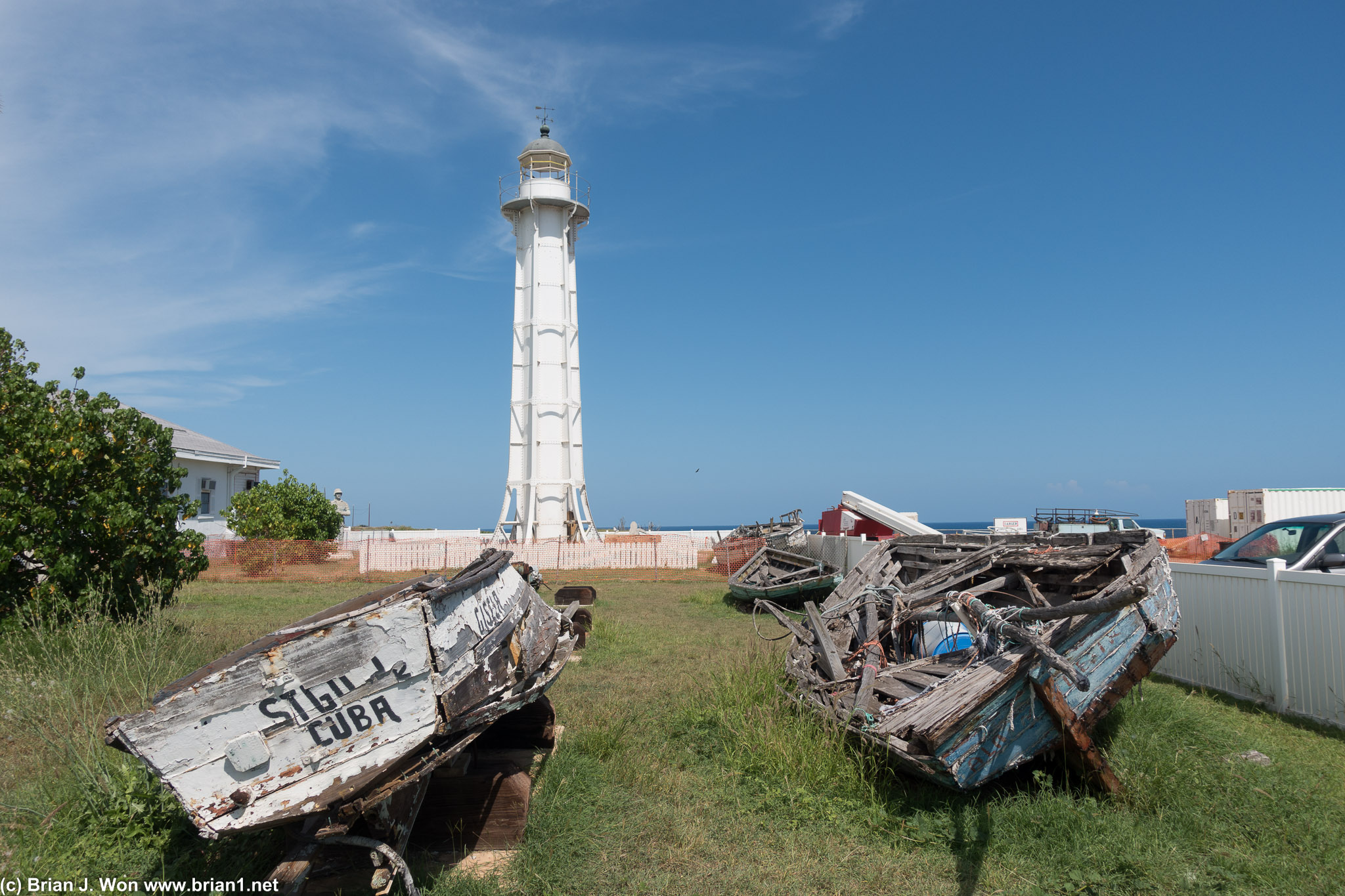 The old lighthouse, boats used by Cubans trying to escape Cuba in the foreground.