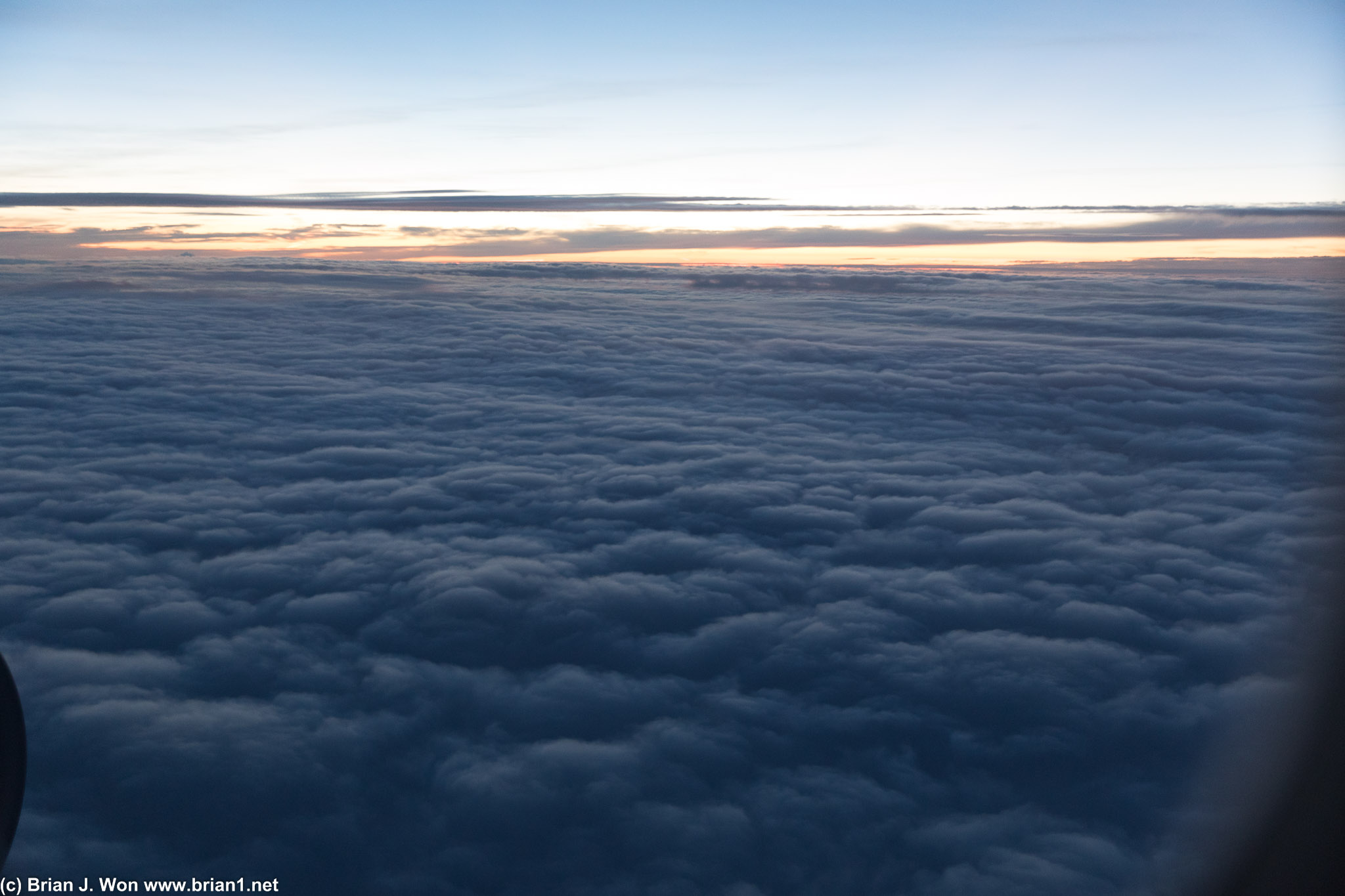 Fluffy clouds ascending from EWR.