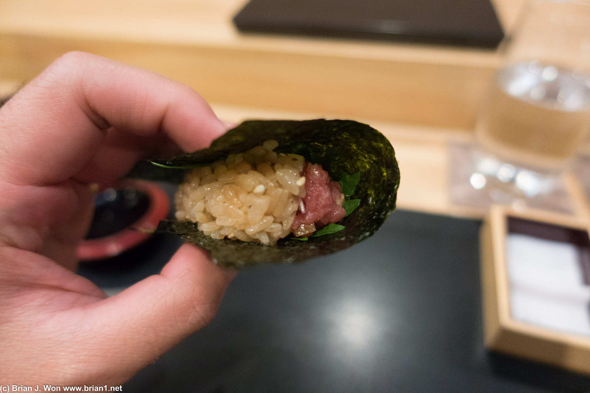 Chopped tuna, shiso leaf, and brown rice hand roll.