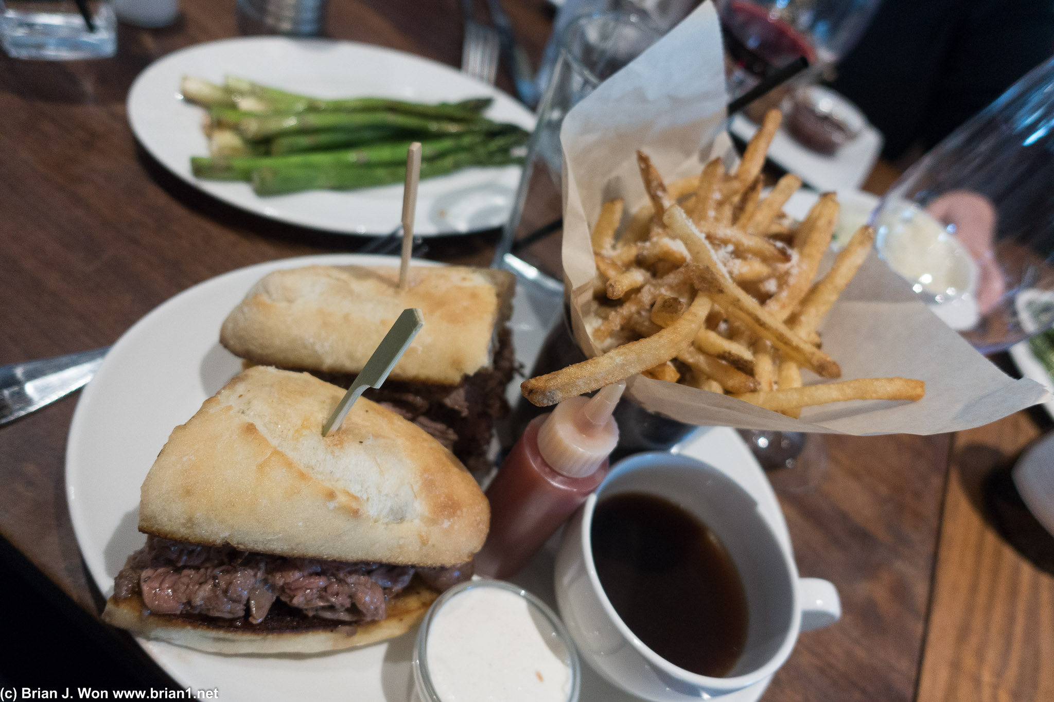 French dip and fries. Asparagus in background.