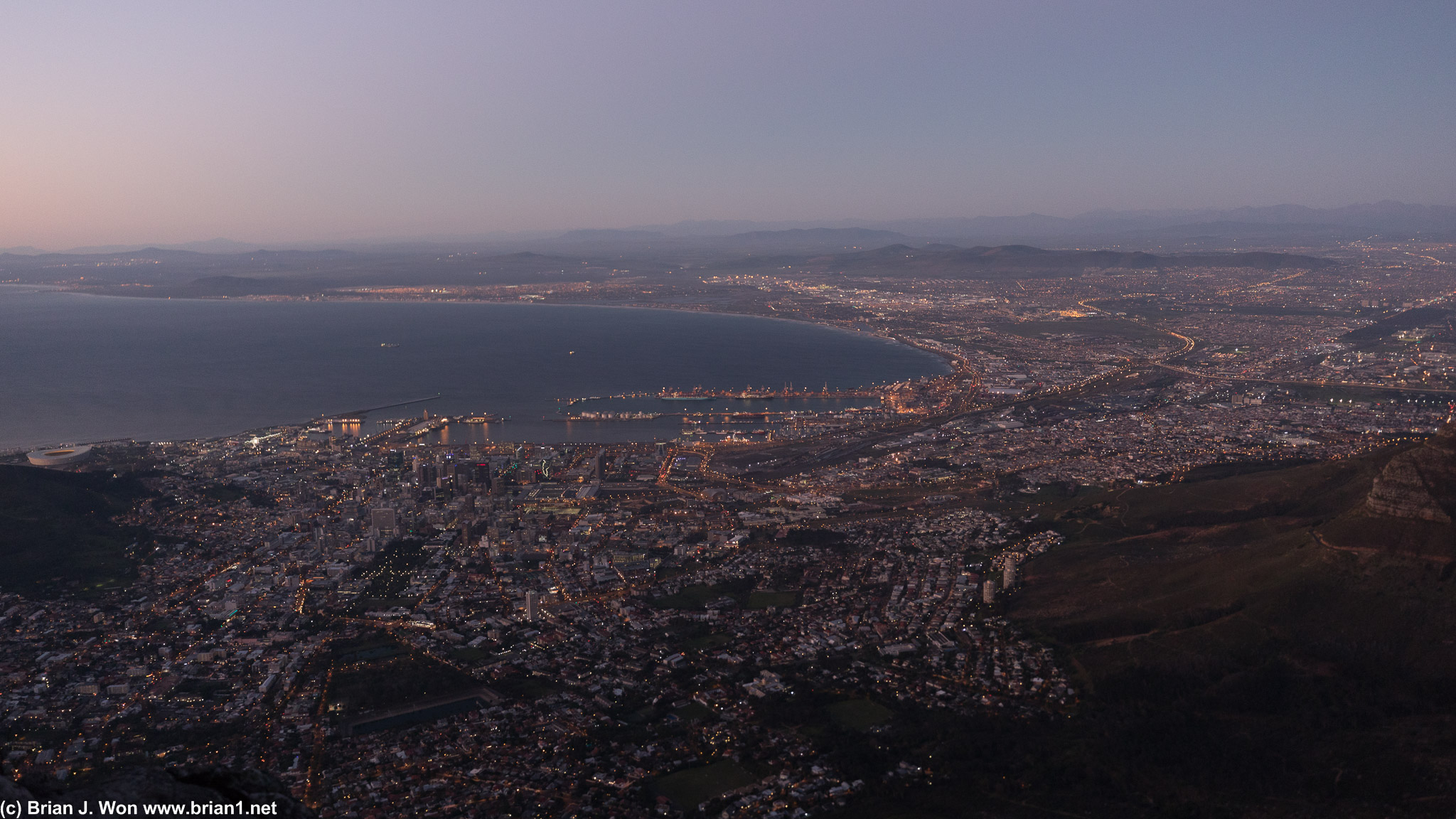 The lights of Cape Town shimmer on to ward off the night.
