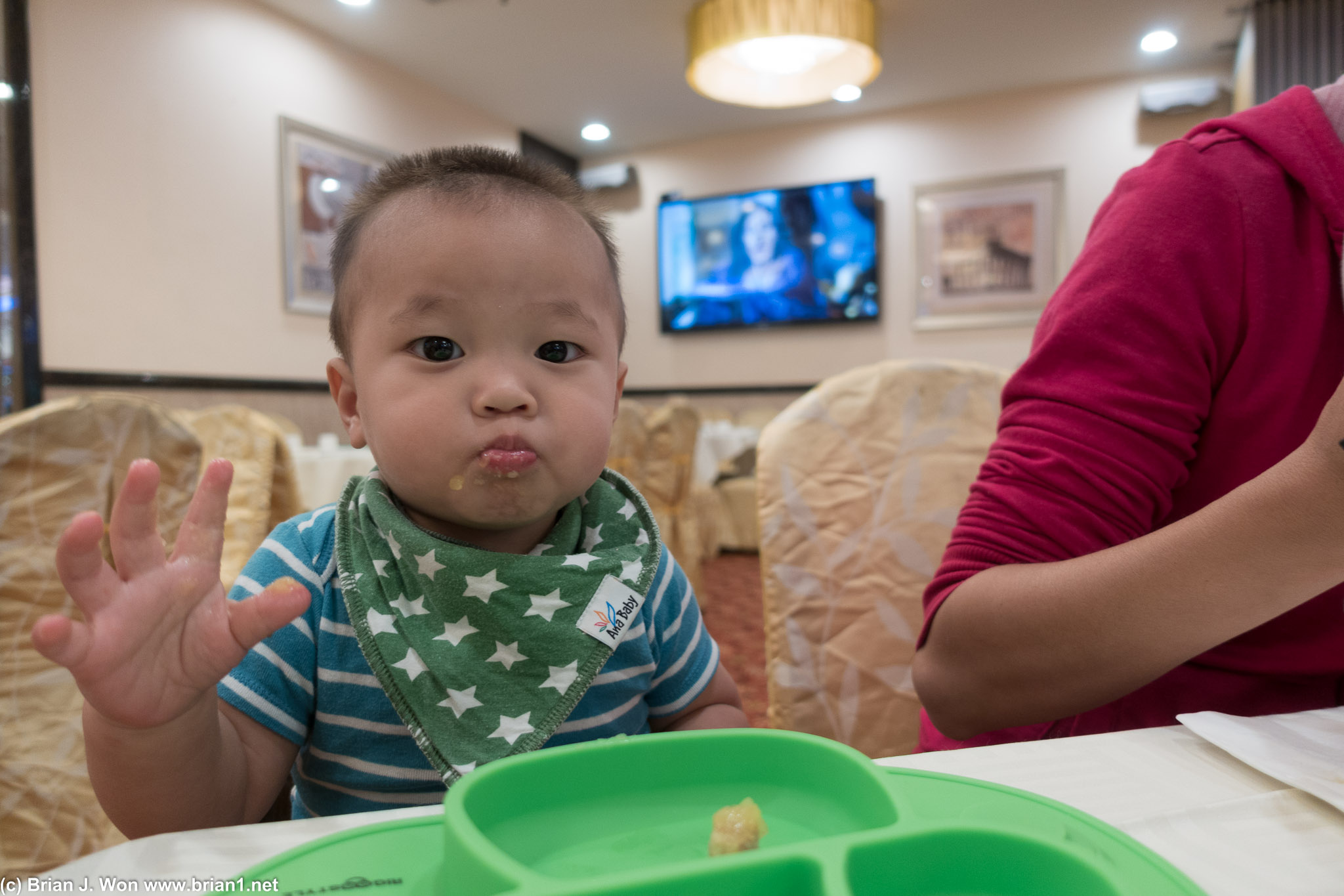Someone getting his first (or one of his first) tastes of dim sum.