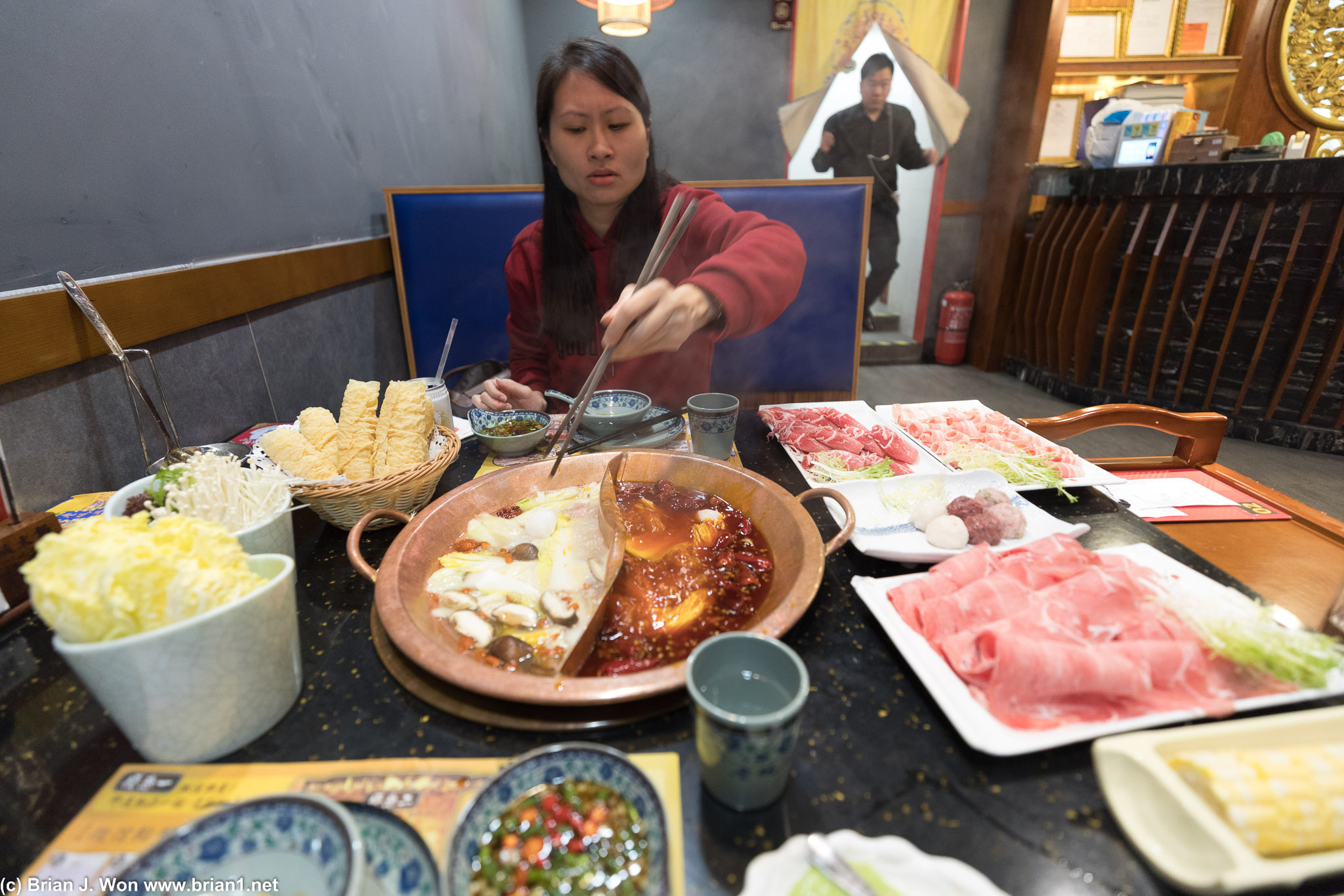 Petula and the spread at Cheng Du Old Pier Hot Pot.