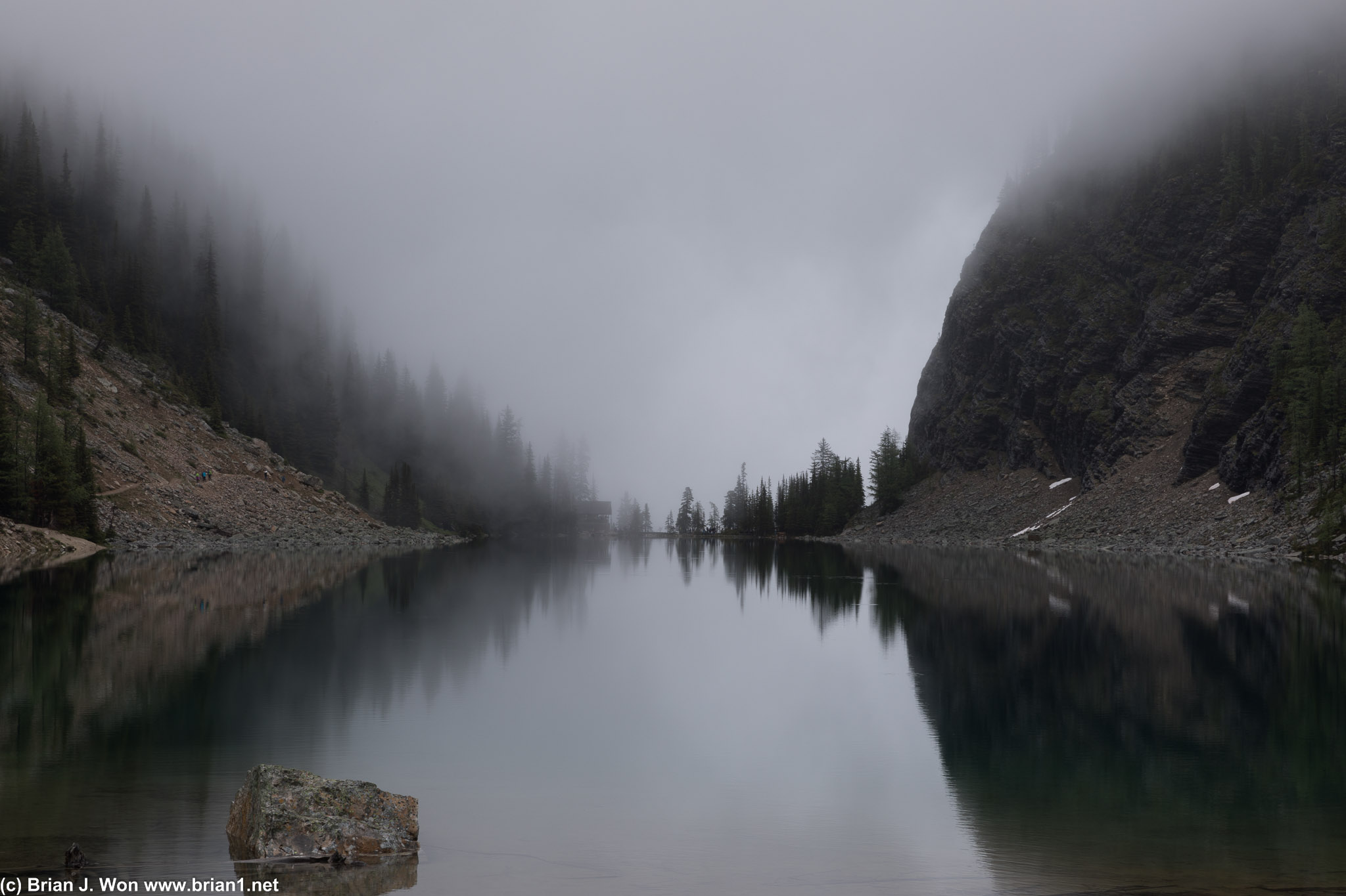 Lake Agnes tea house shrouded by clouds.