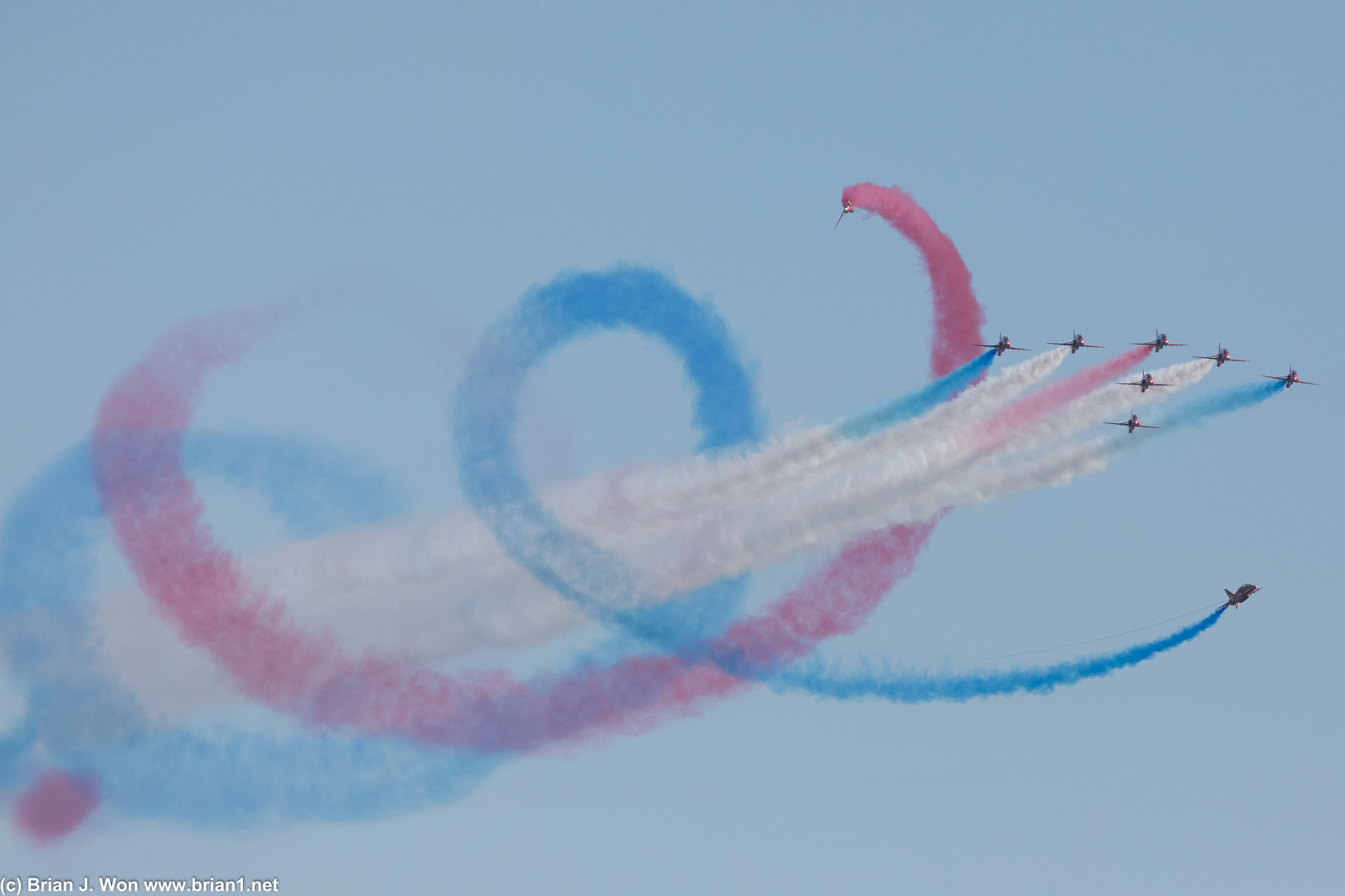 Two Red Arrows weave a colorful spiral around the rest of the formation.