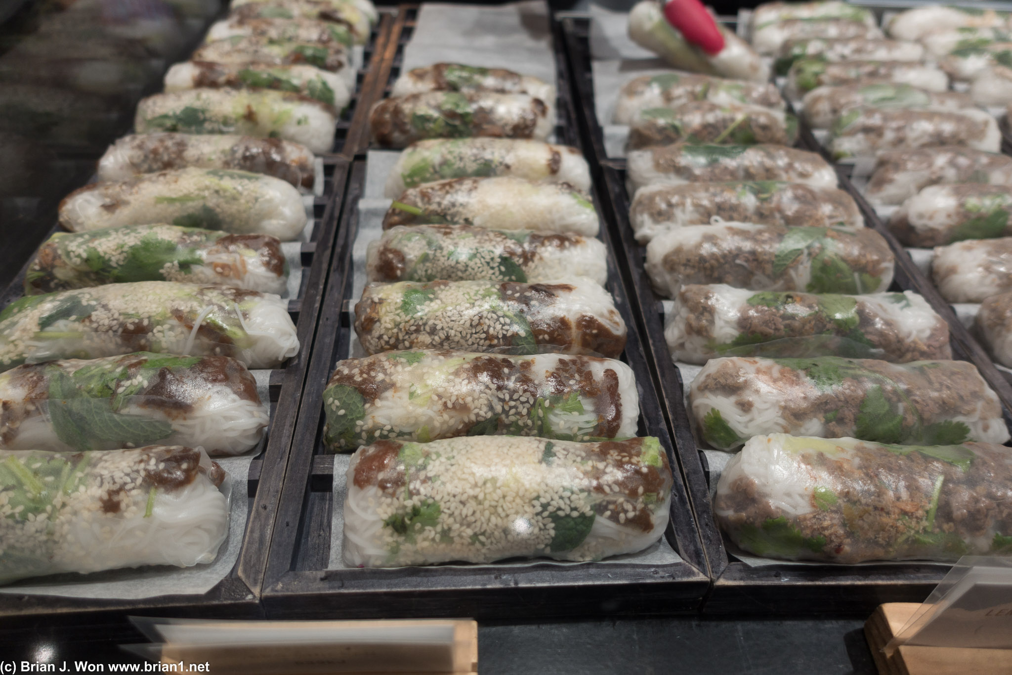 Trays and trays of fresh made spring rolls.