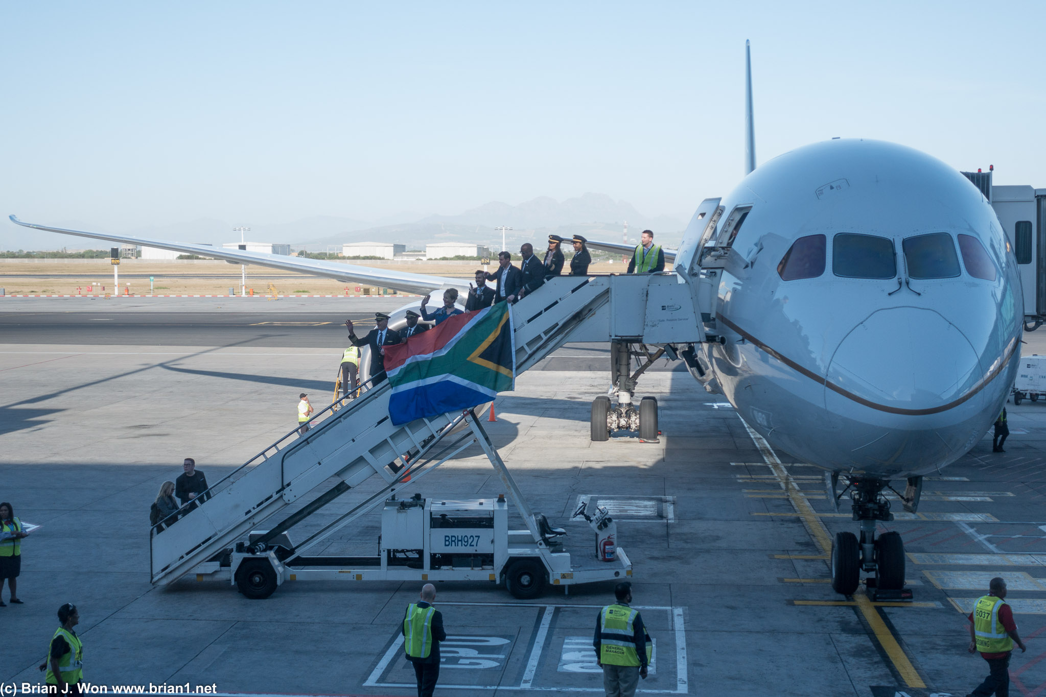 Flight crew flies the South Africian flag to celebrate the inaugural flight.