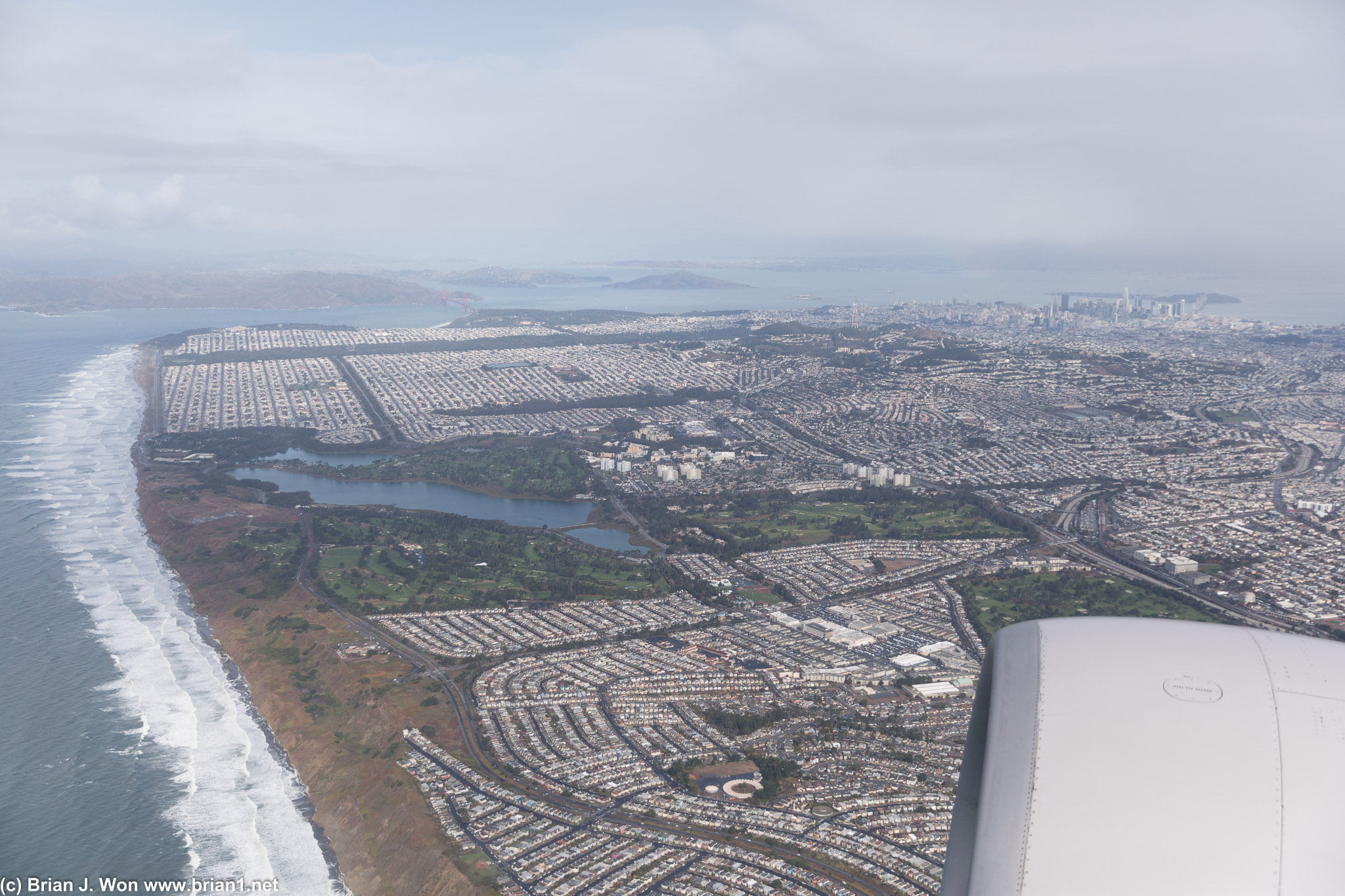 Feet wet over Daly City, with Lake Merced at left and San Francisco in the background.