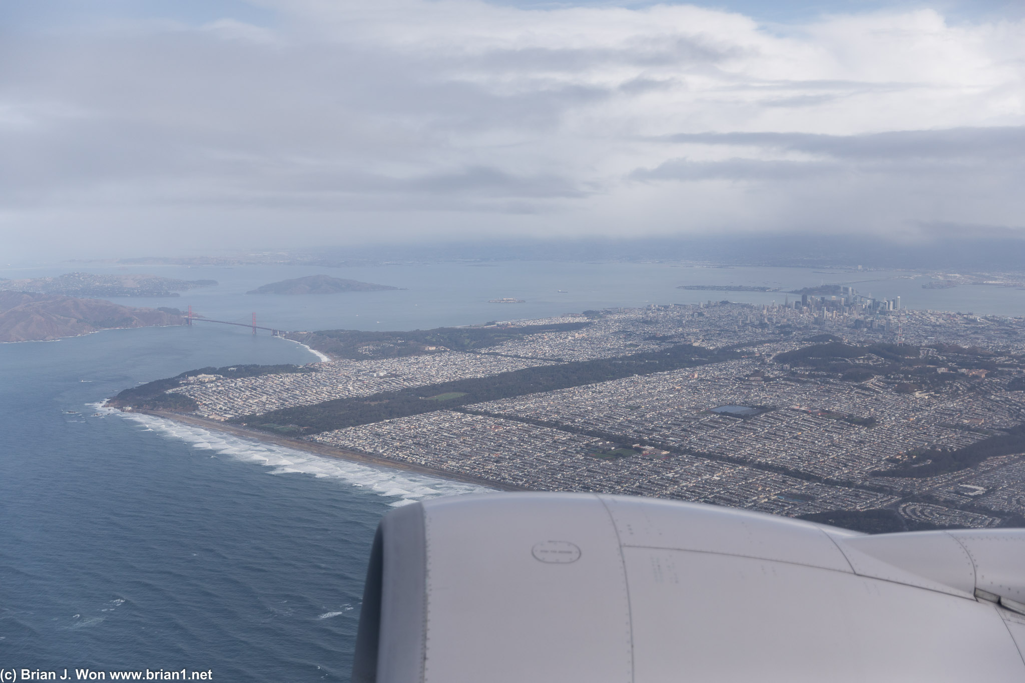 The Golden Gate Bridge, Golden Gate Park, and the skyscrapers of the Financial District in the distance.