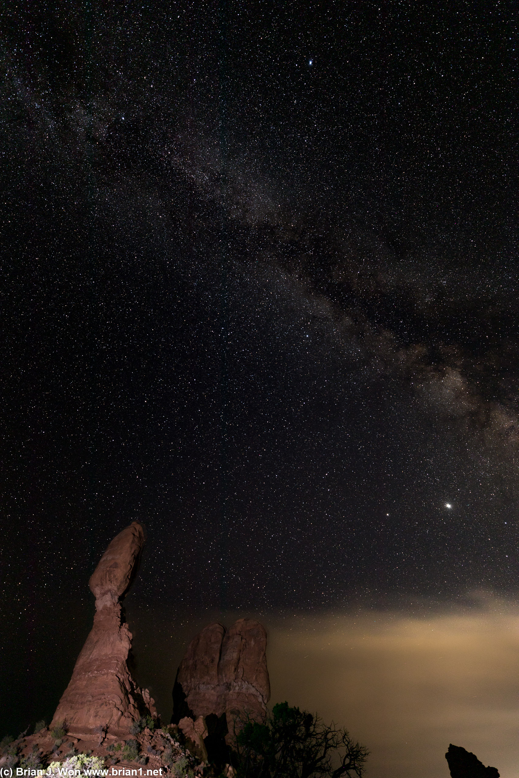 Light pollution and haze, meet the Milky Way and Balanced Rock.