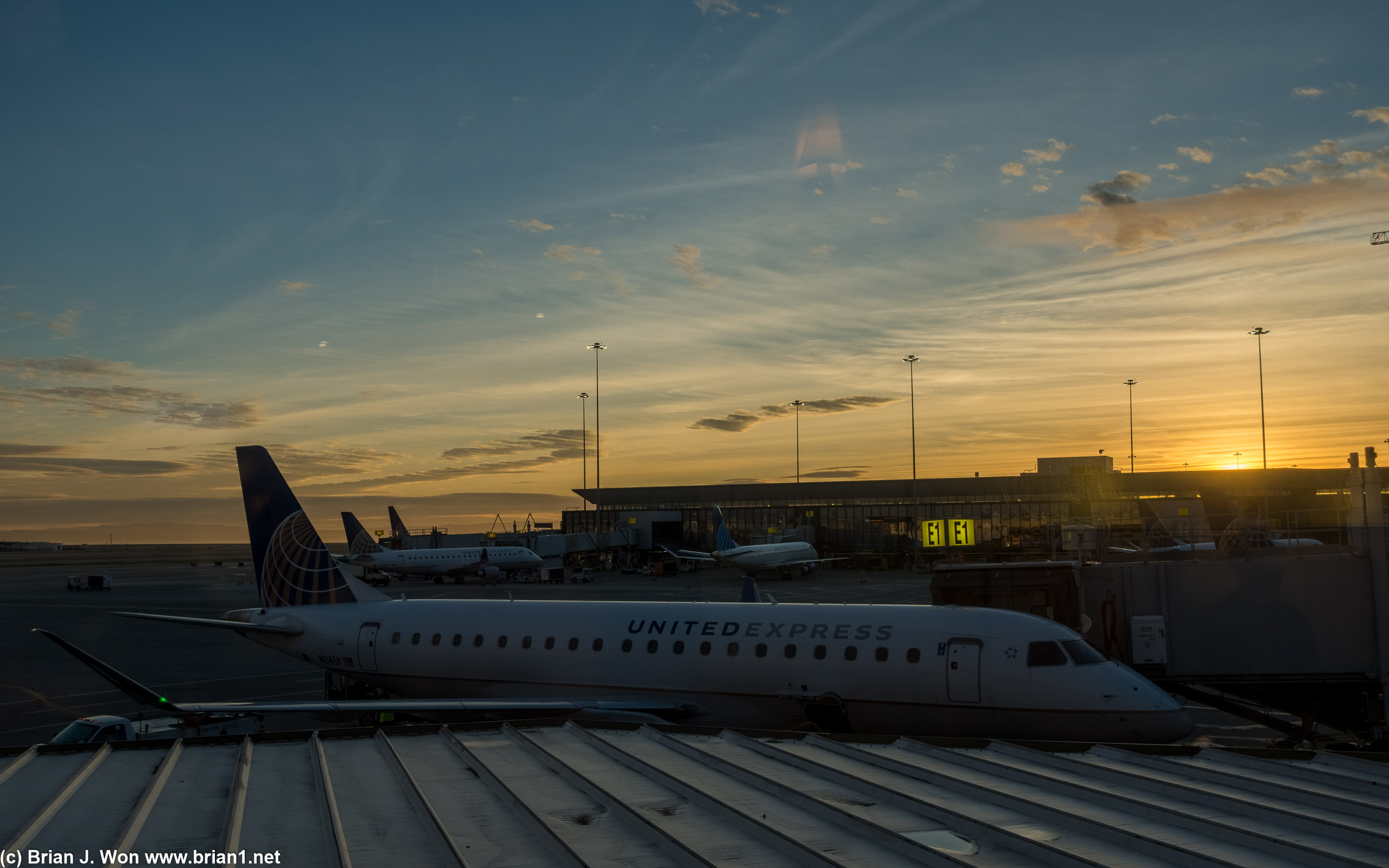 Sunrise over a United Express regional jet.