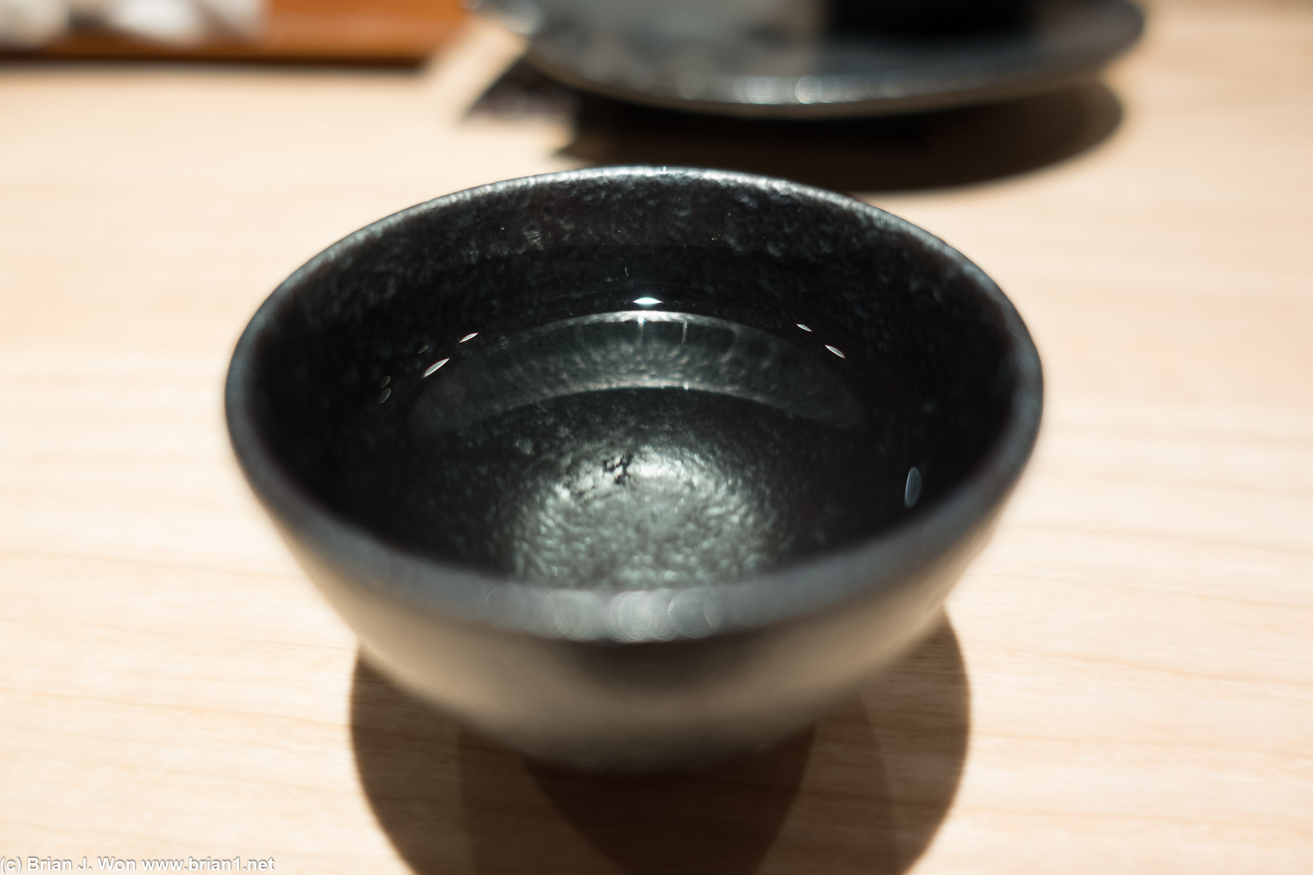 Reflections in the sake cup.