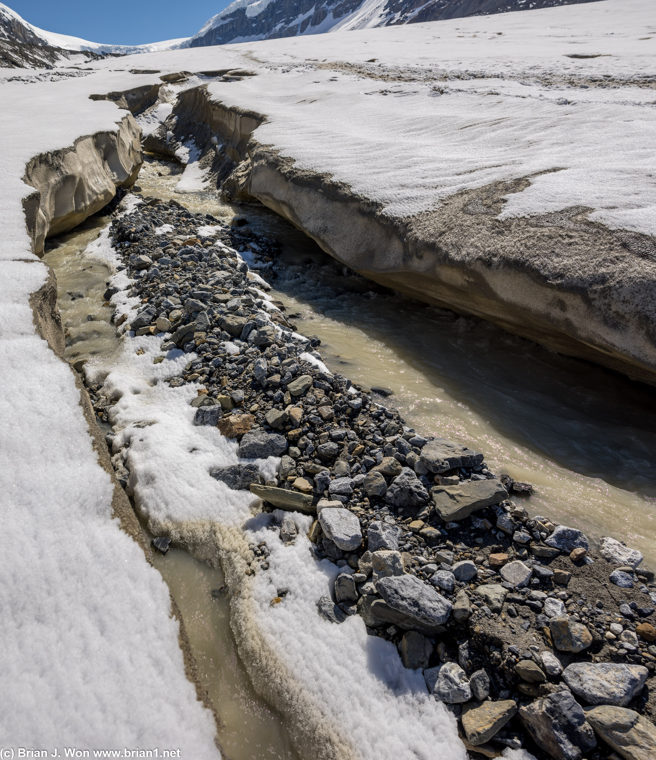 Supraglacial channels carry rocks, too.