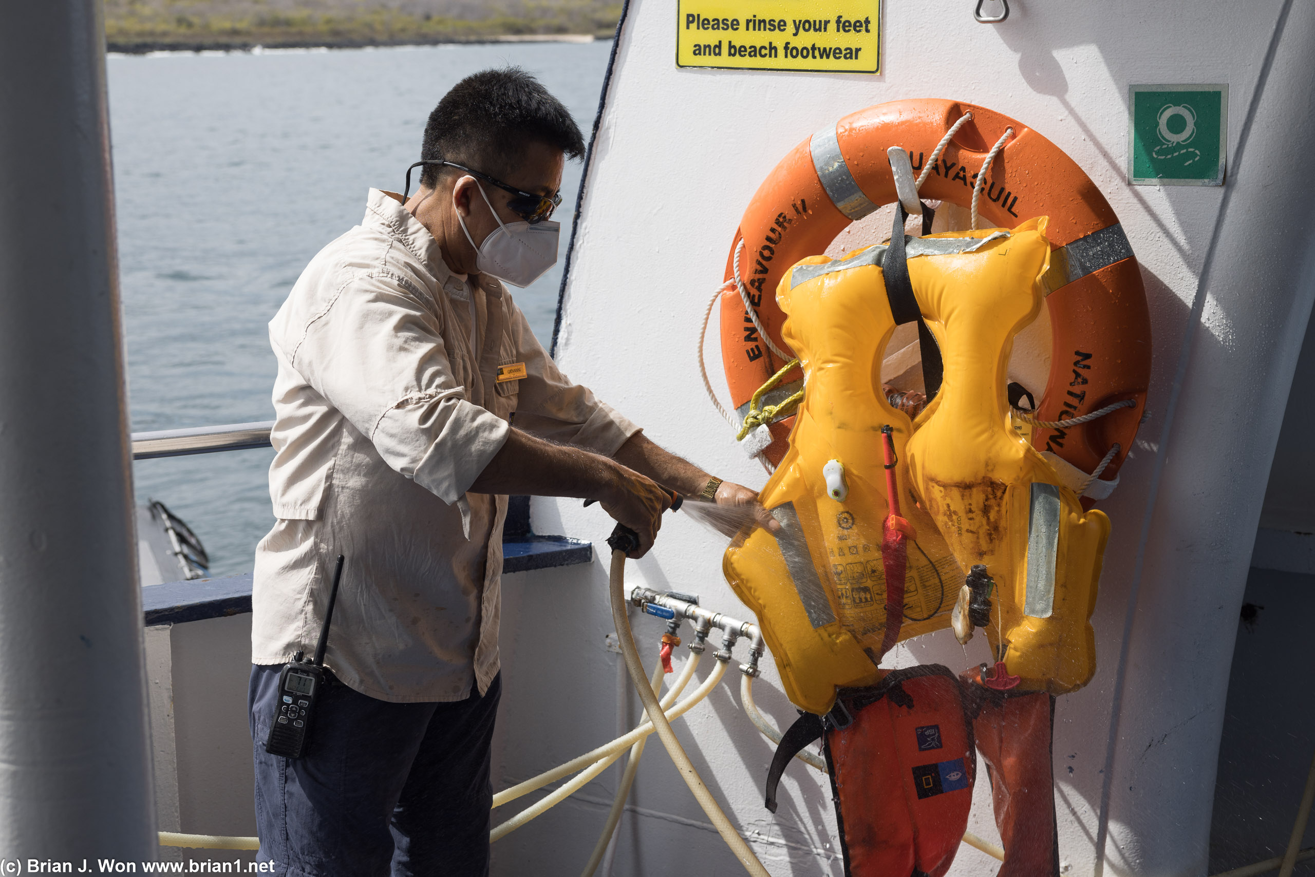 Another passenger accidentially activated a life preserver. Giovanni's cleaning it up to be repacked and reused.