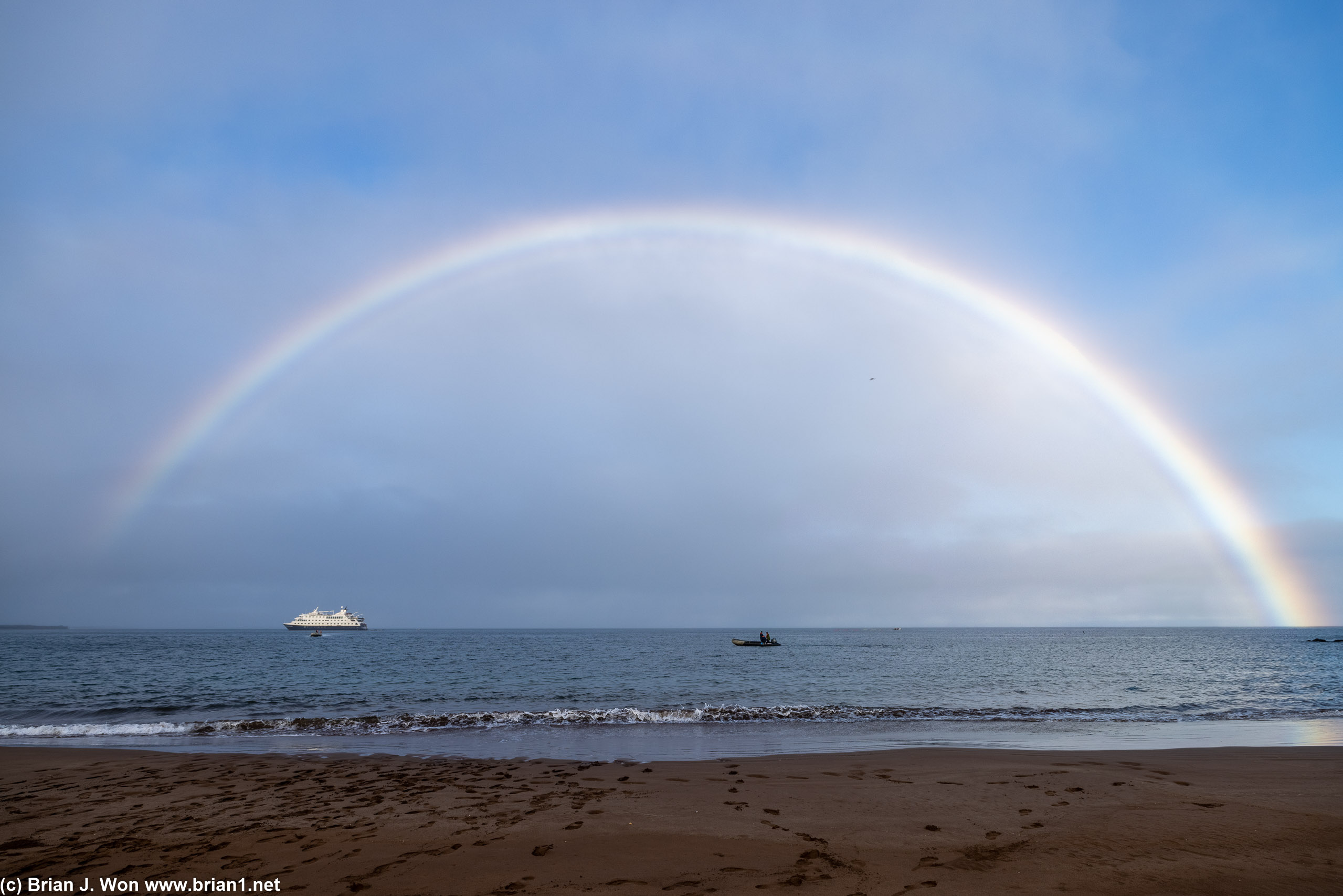 Morning rainbow over Espumilla beach, Isla Santiago.