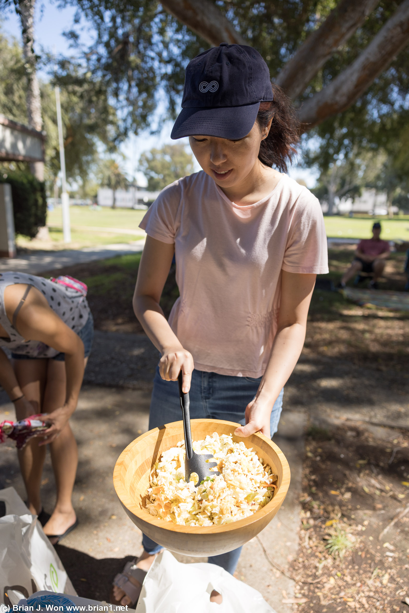 Joy helping Caroline with salad.