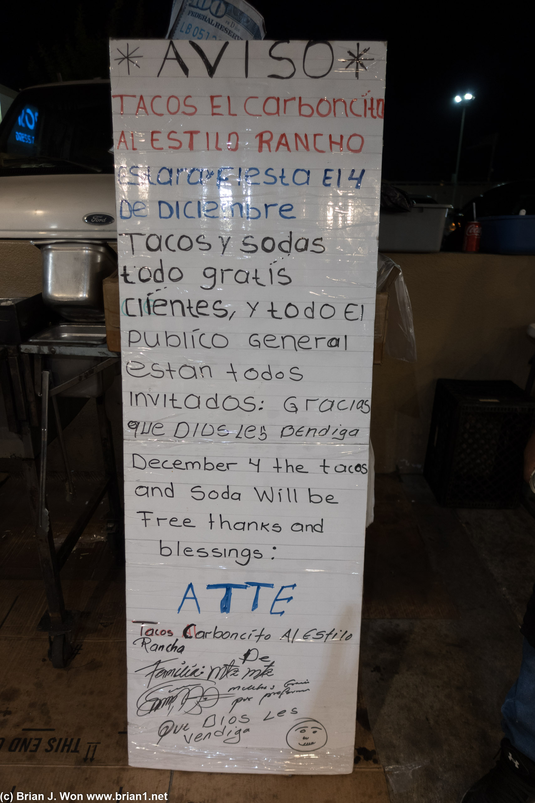 Local taco stand advertising free tacos and soda on 4 December 2022.