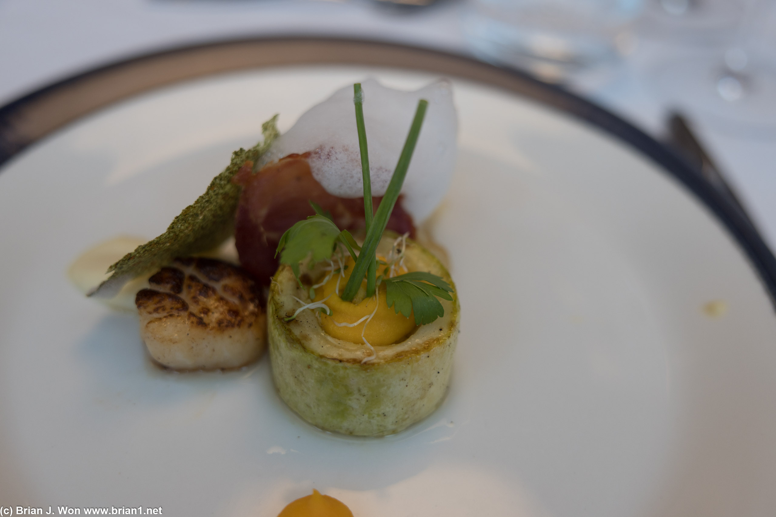 Patagonian tootfish, king scallop, cauliflower mousse, highlighted with parsley-lemon foam.