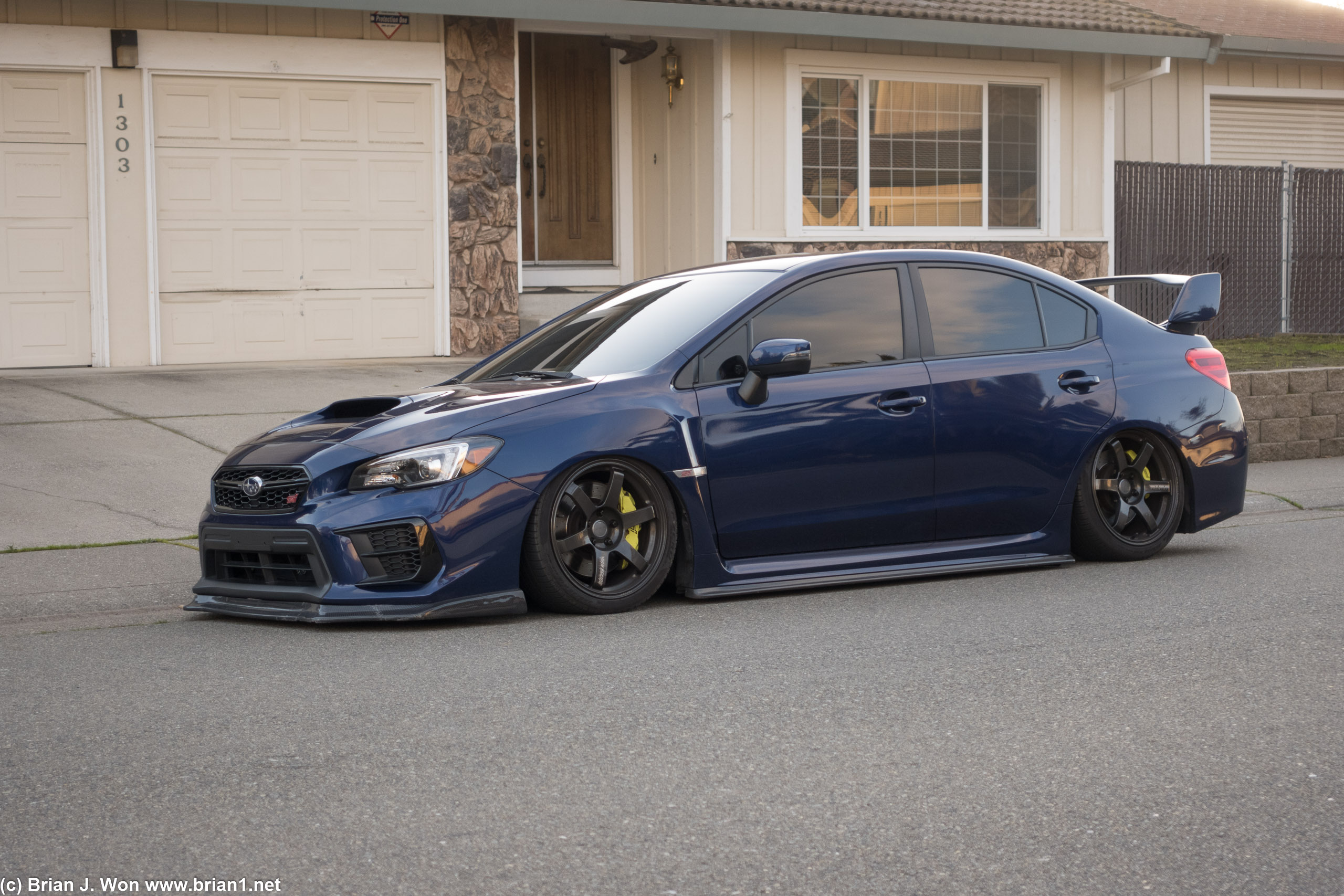 This poor WRX STI (VA) is si low it probably has issues going over carpet and leaves.