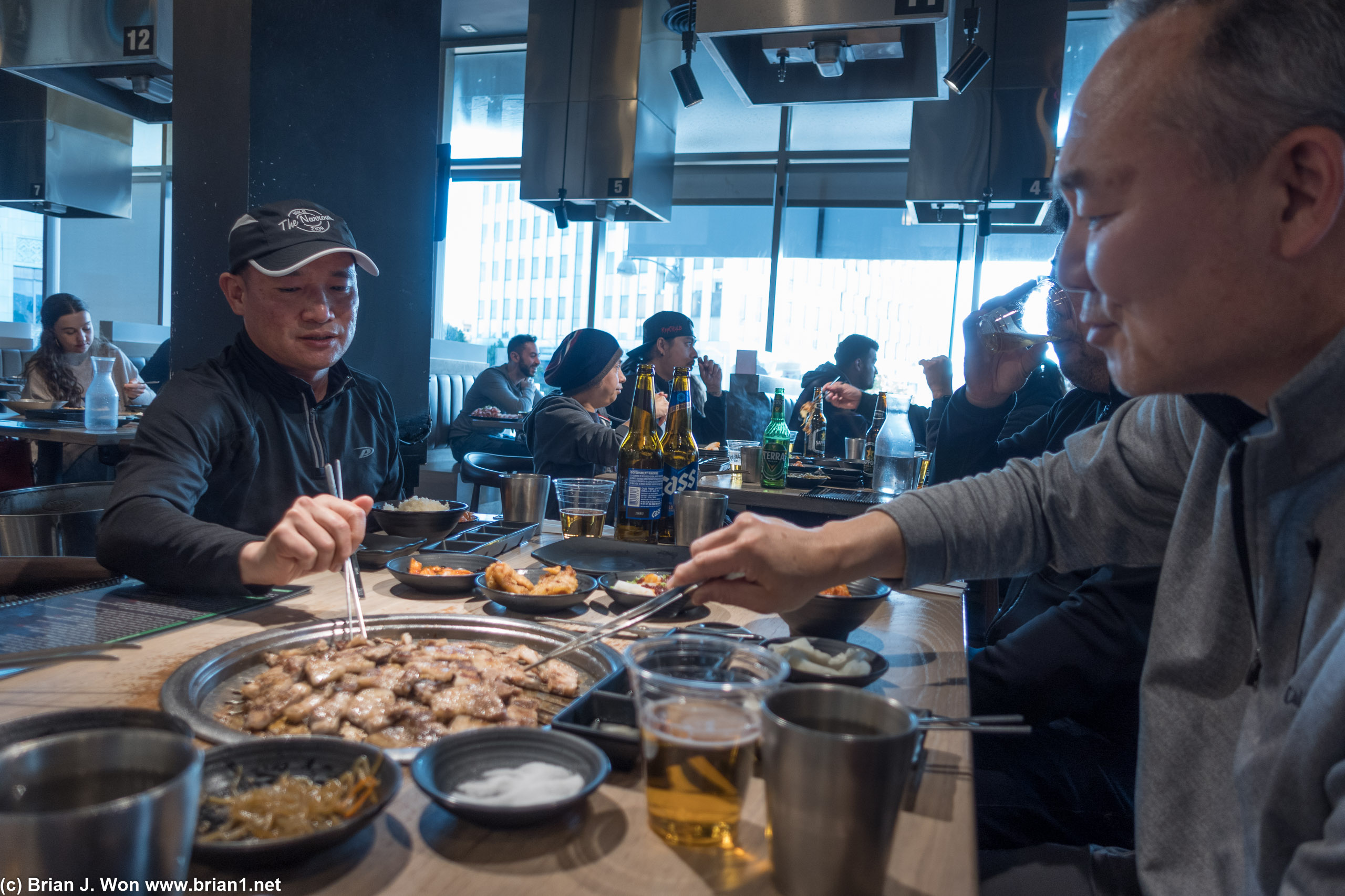 Mike and Harold busy eating and cooking.