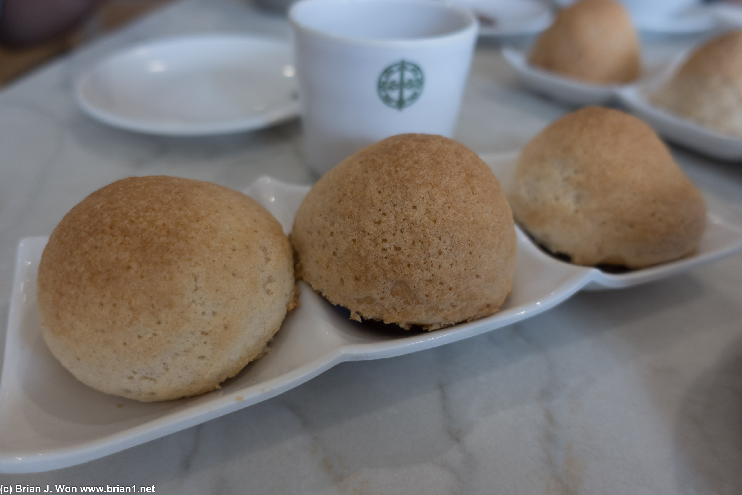 The famous baked char shu bao, with their thin fluffy sweet crust.
