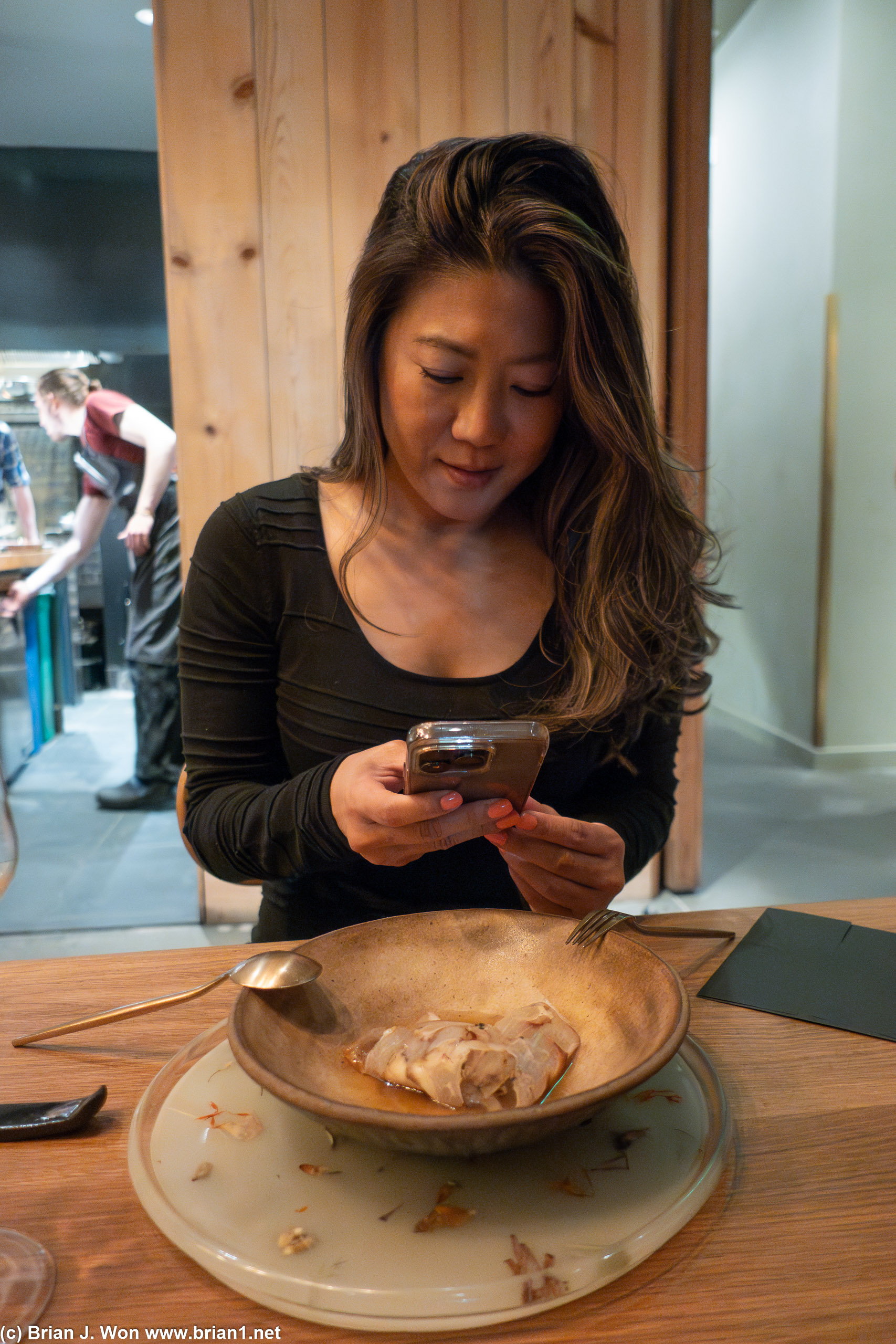 Diana photographing her food.