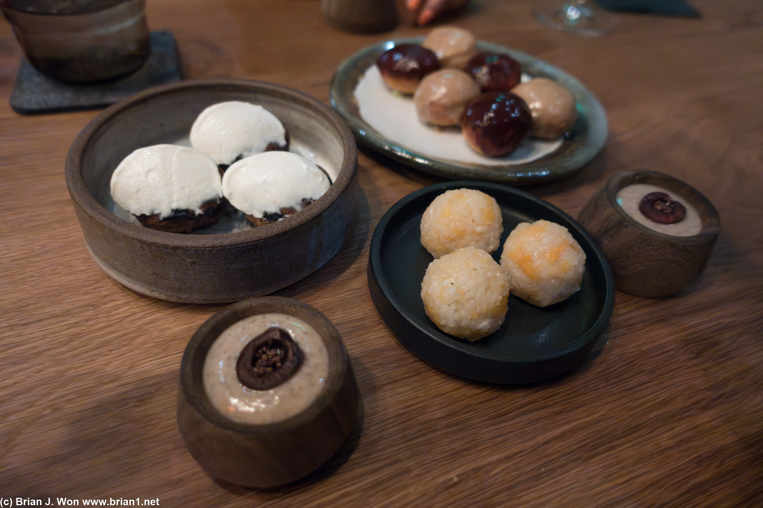 Dessert spread, including cocoa nib pudding at far right.