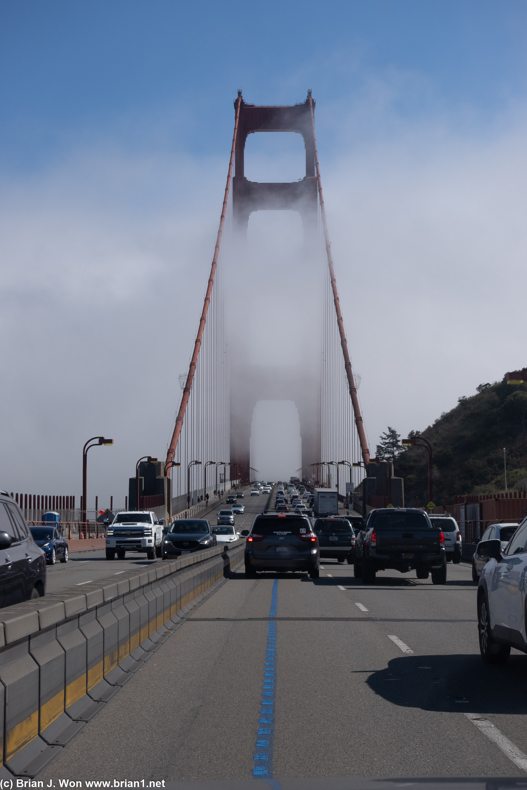 Fog-shrouded Golden Gate Bridge.