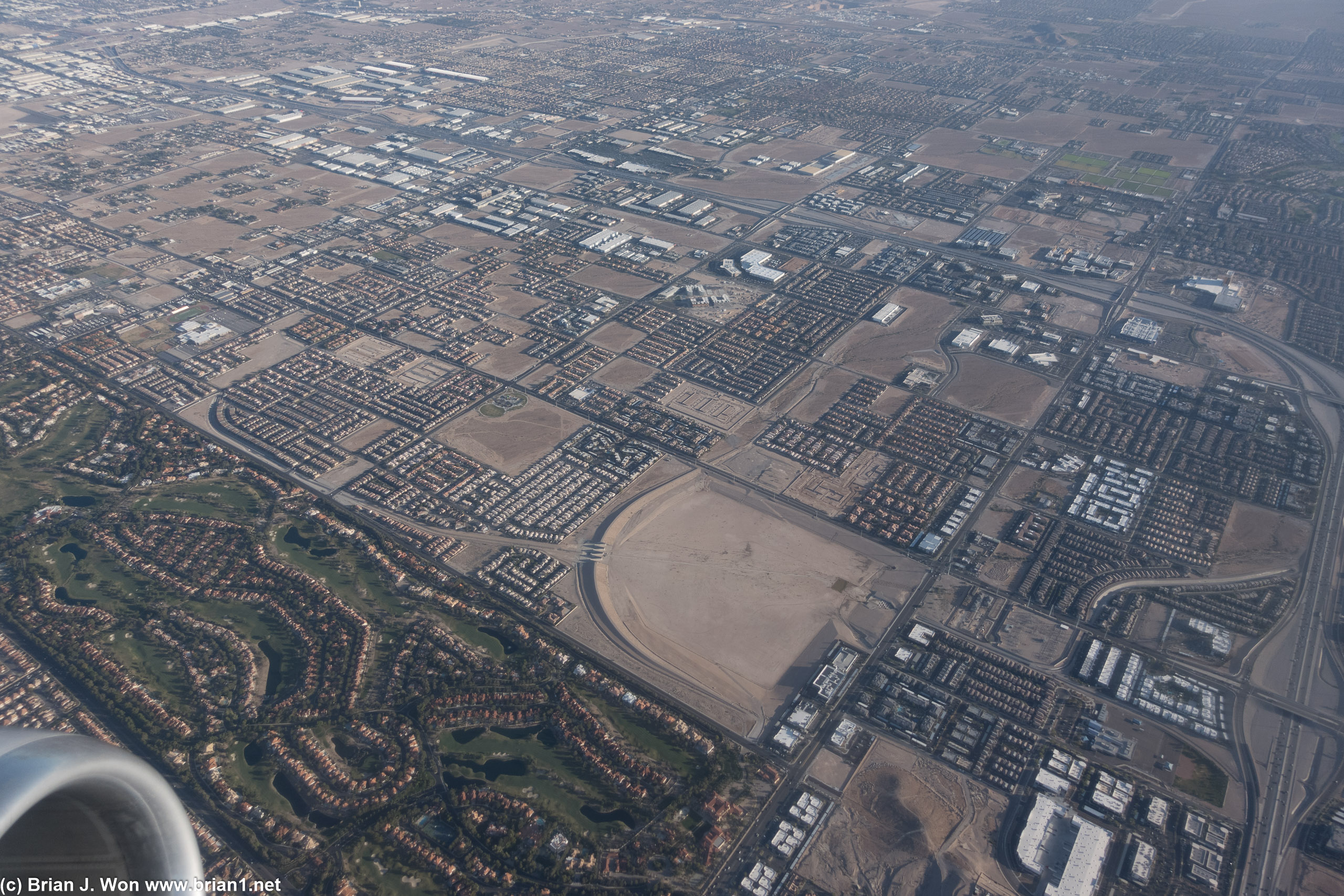 Golf course next to a dam/pond among rows of tract homes?