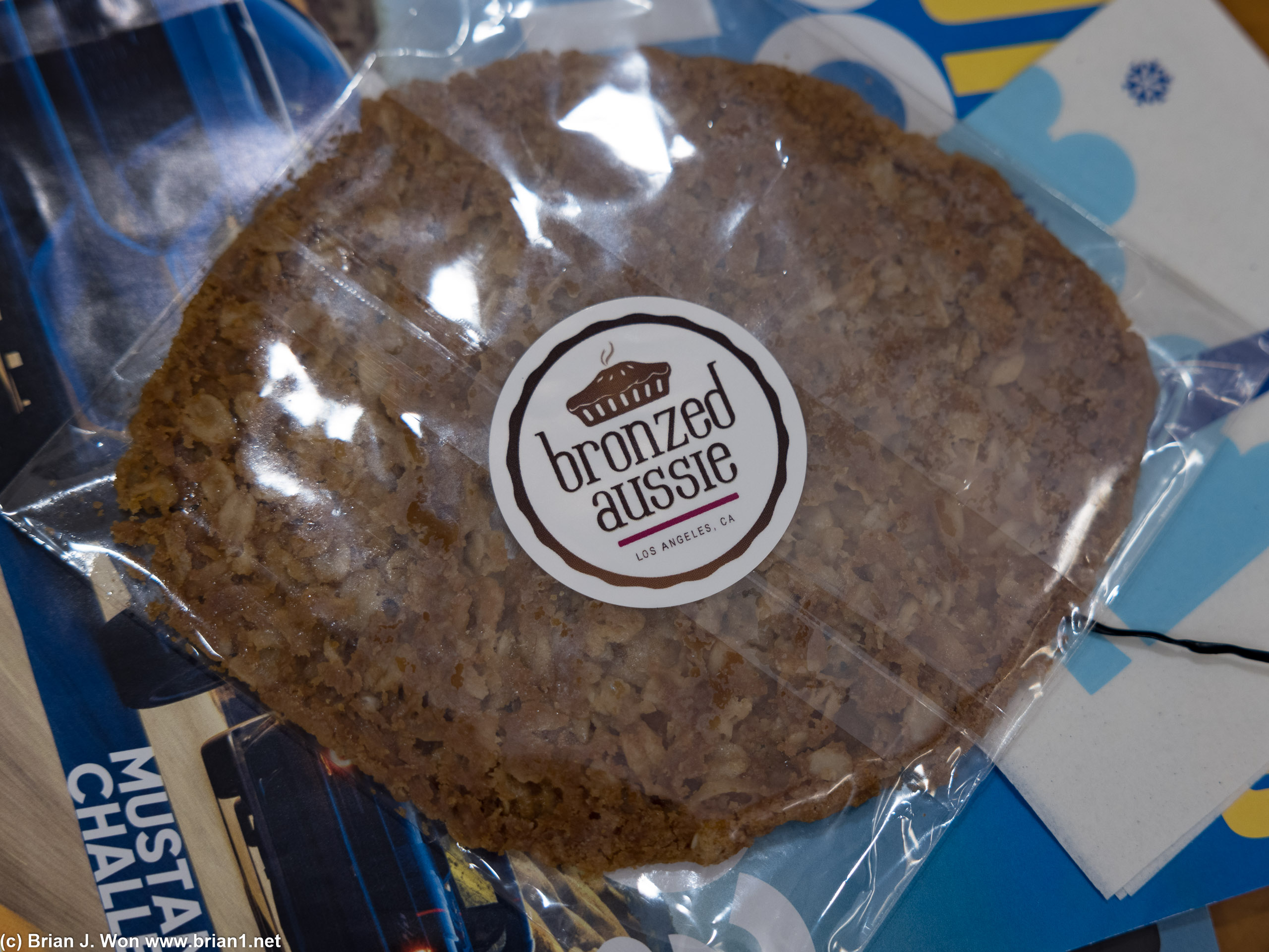 Close-up of the big and very flat oatmeal cookie.