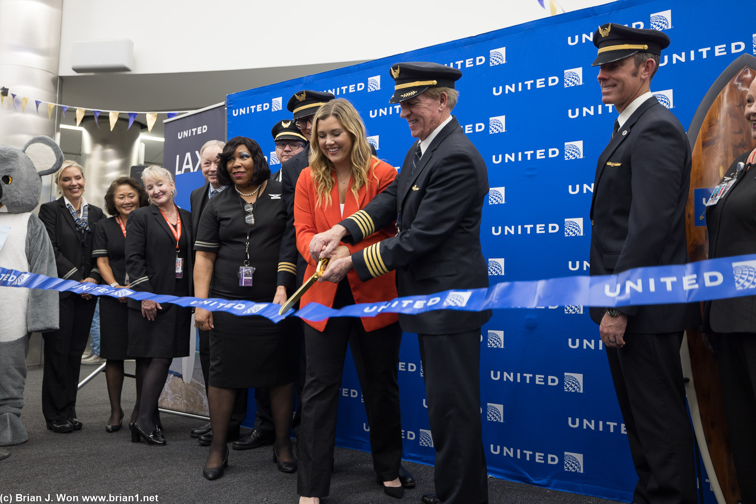 RIbbon cutting with Maggie Ronan, Director of Global Market Strategy. United Airlines.