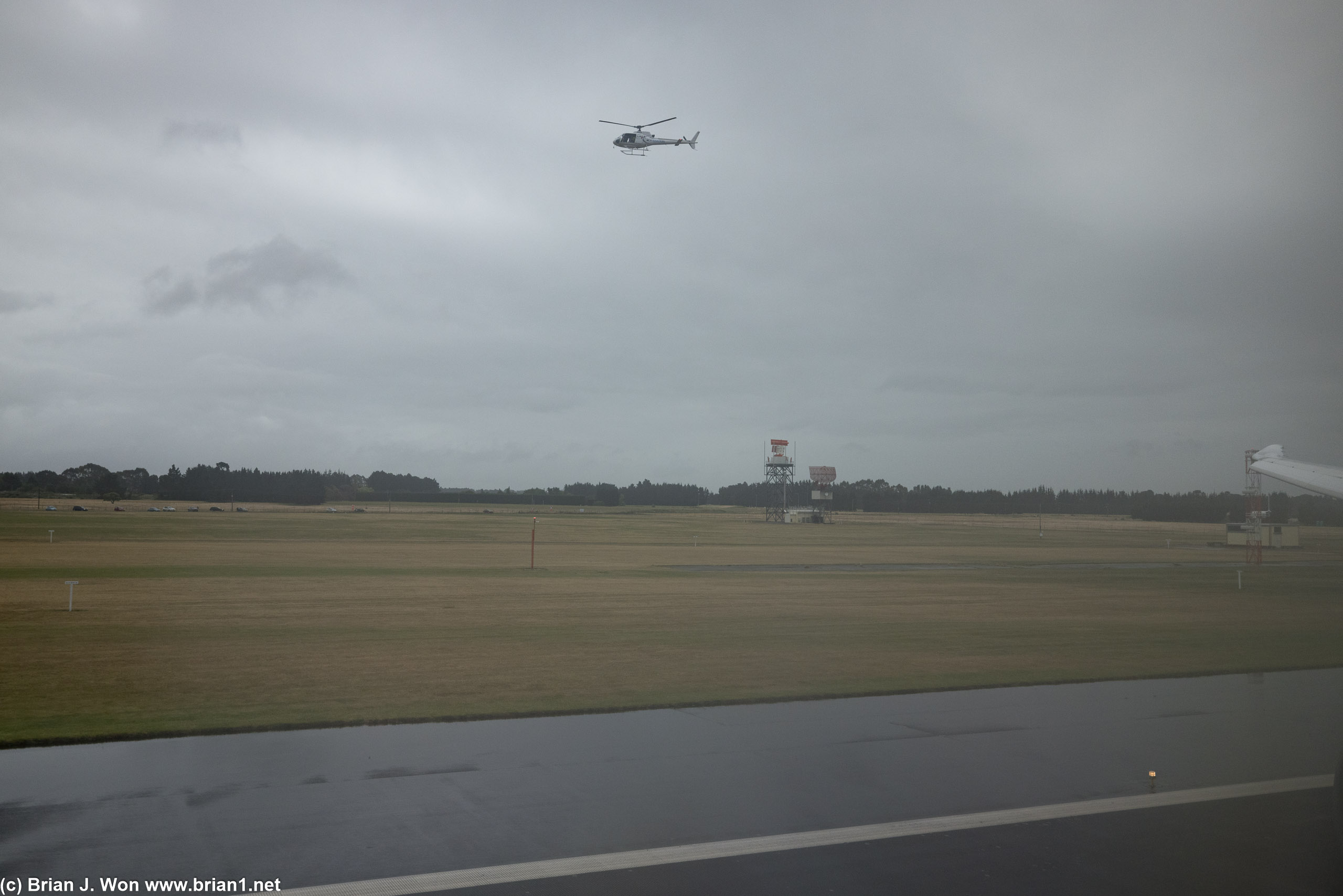 One of the two helicopters recording the arrival of United's inaugural flight from SFO to Christchurch.