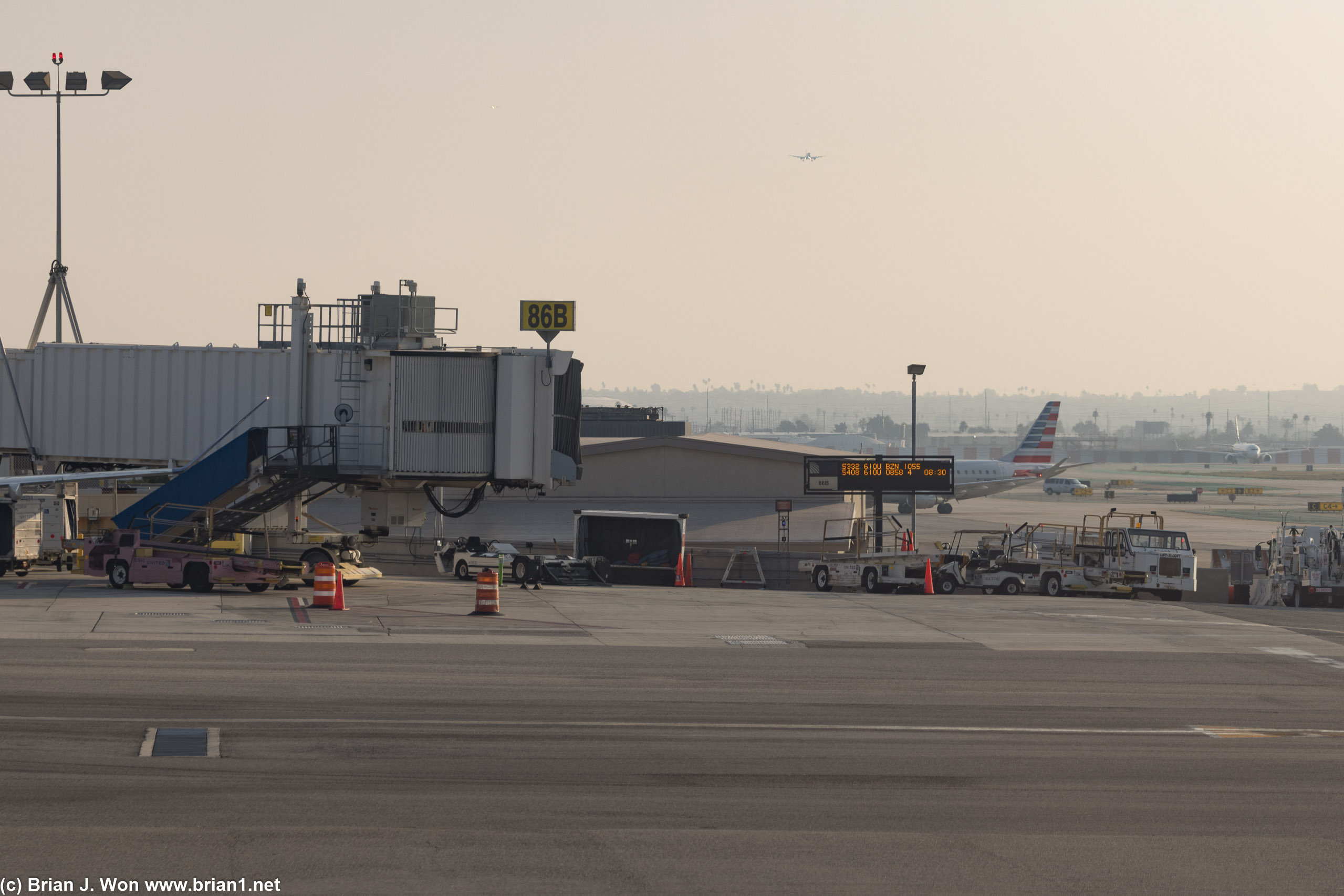 Looking across at Terminal 8, with an American Airlines jet inbound in the distance.